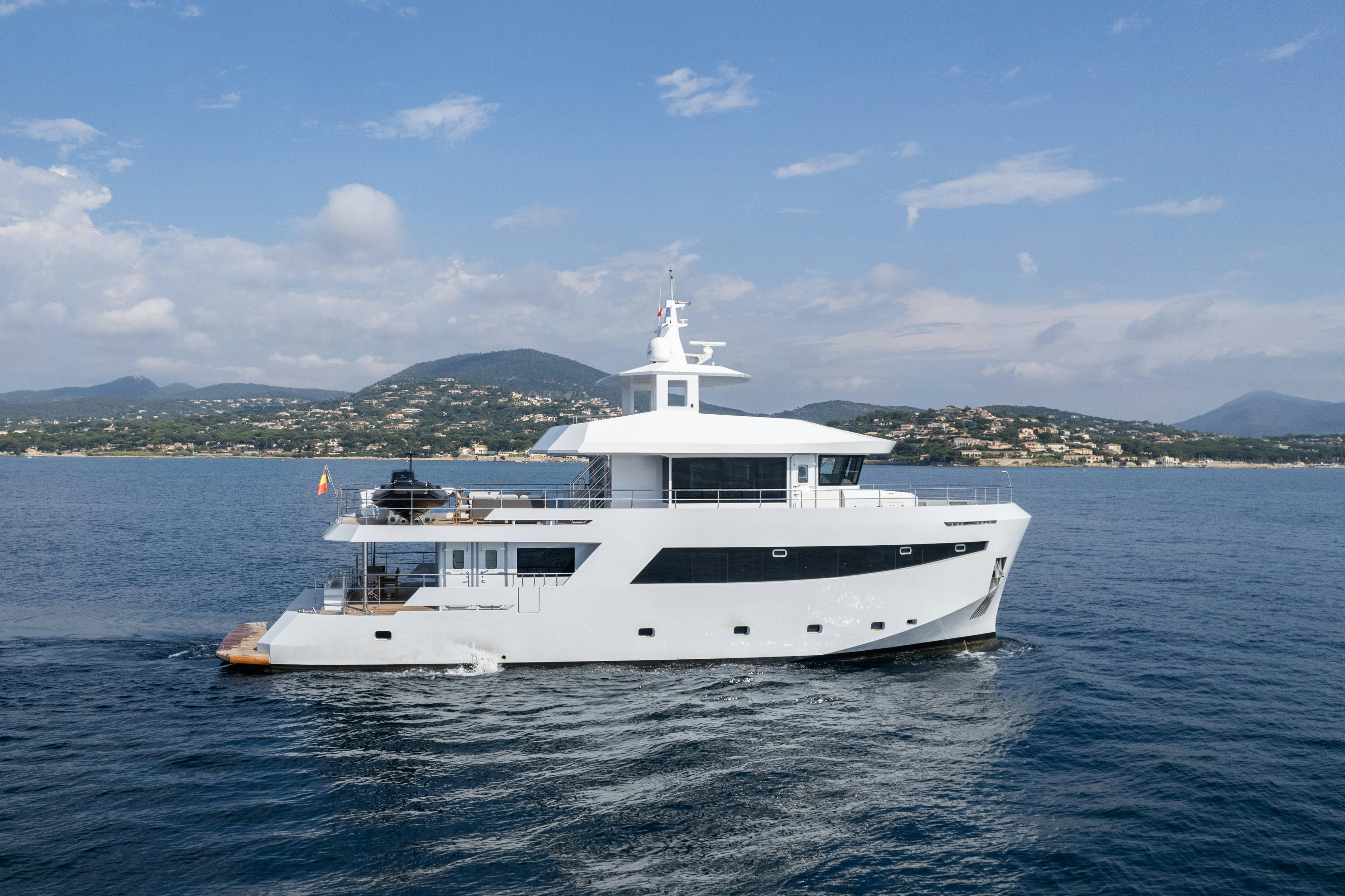 a white yacht in the water aboard ICE Yacht for Sale