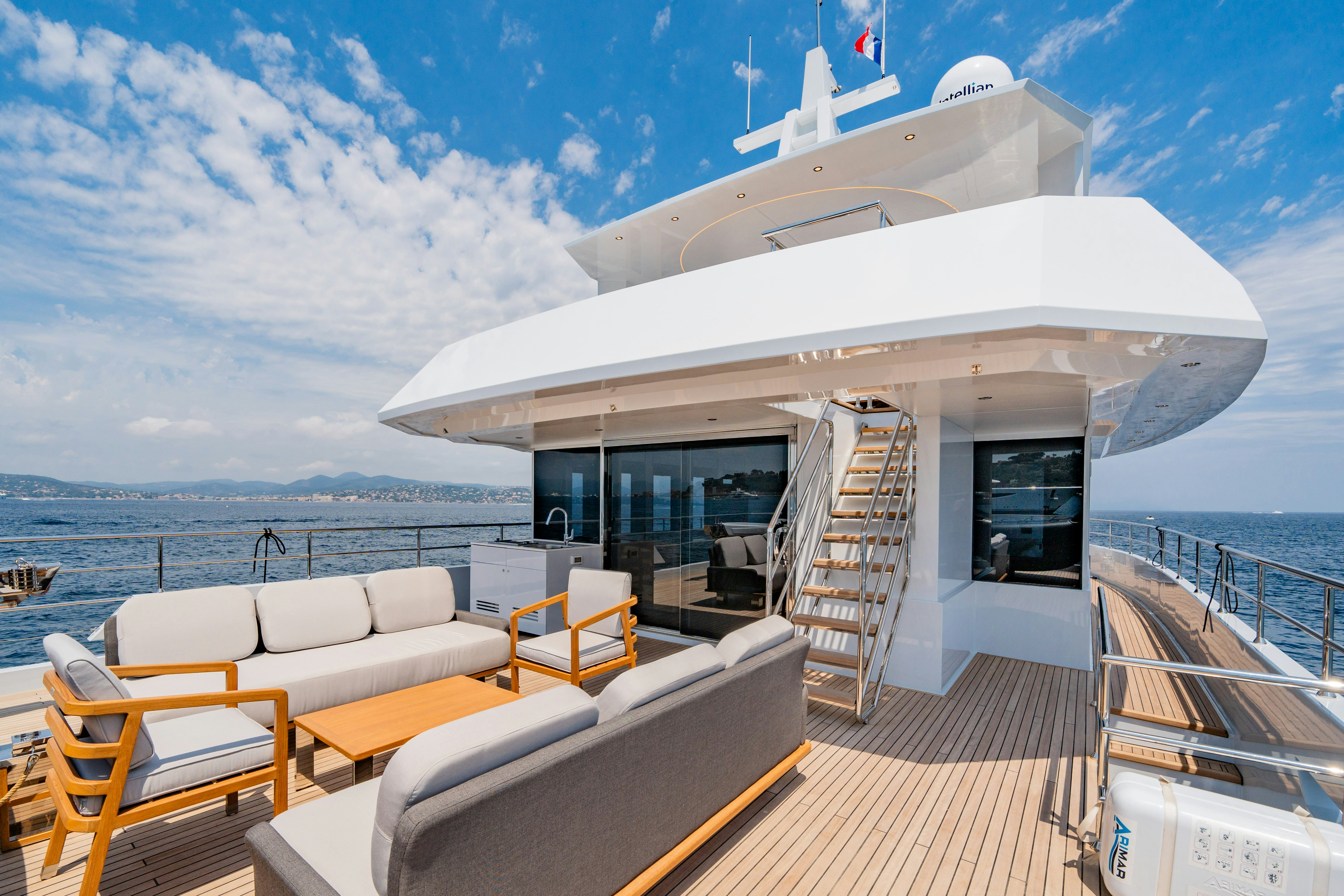 a large white boat on a deck aboard ICE Yacht for Sale