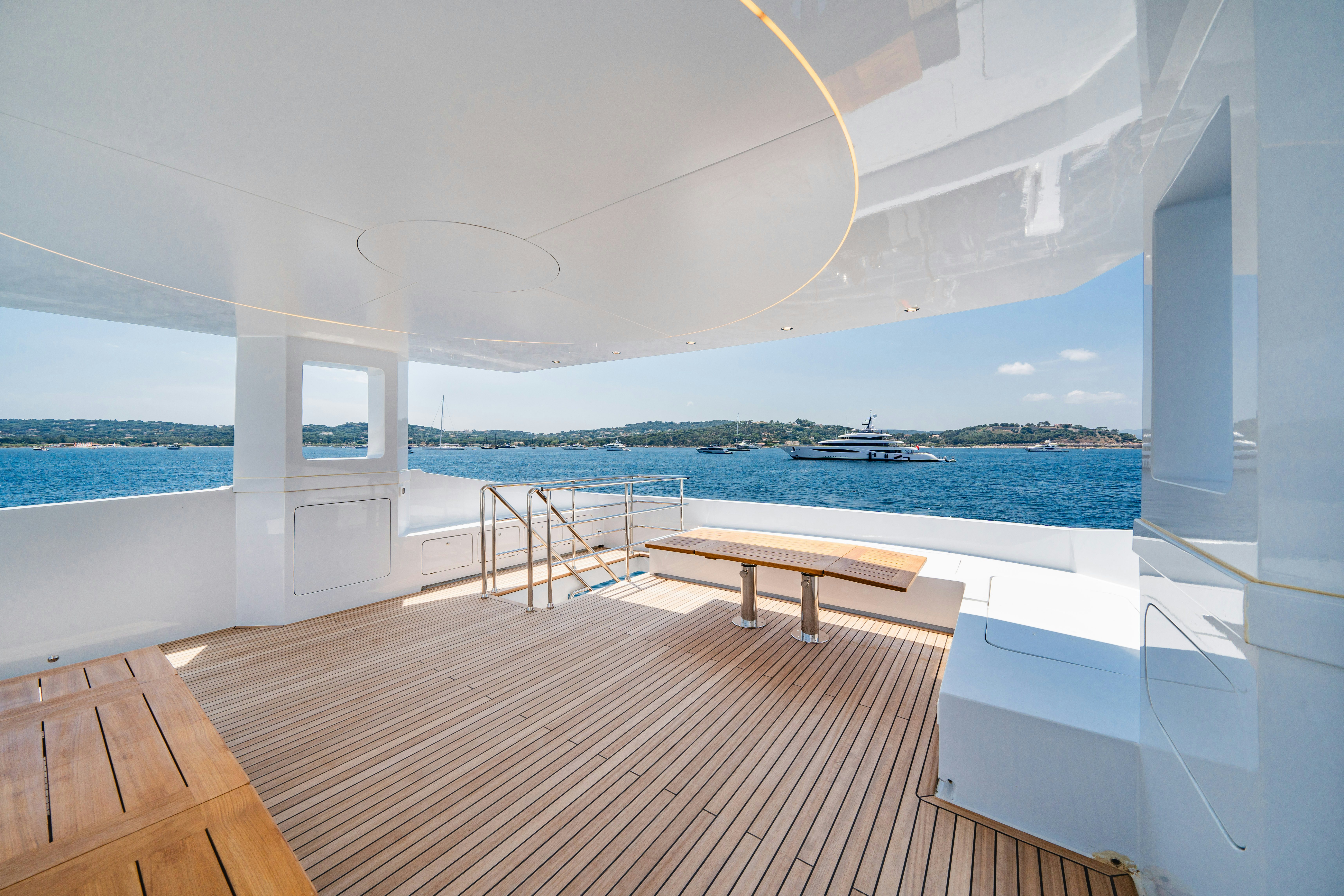 a room with a table and chairs aboard ICE Yacht for Sale