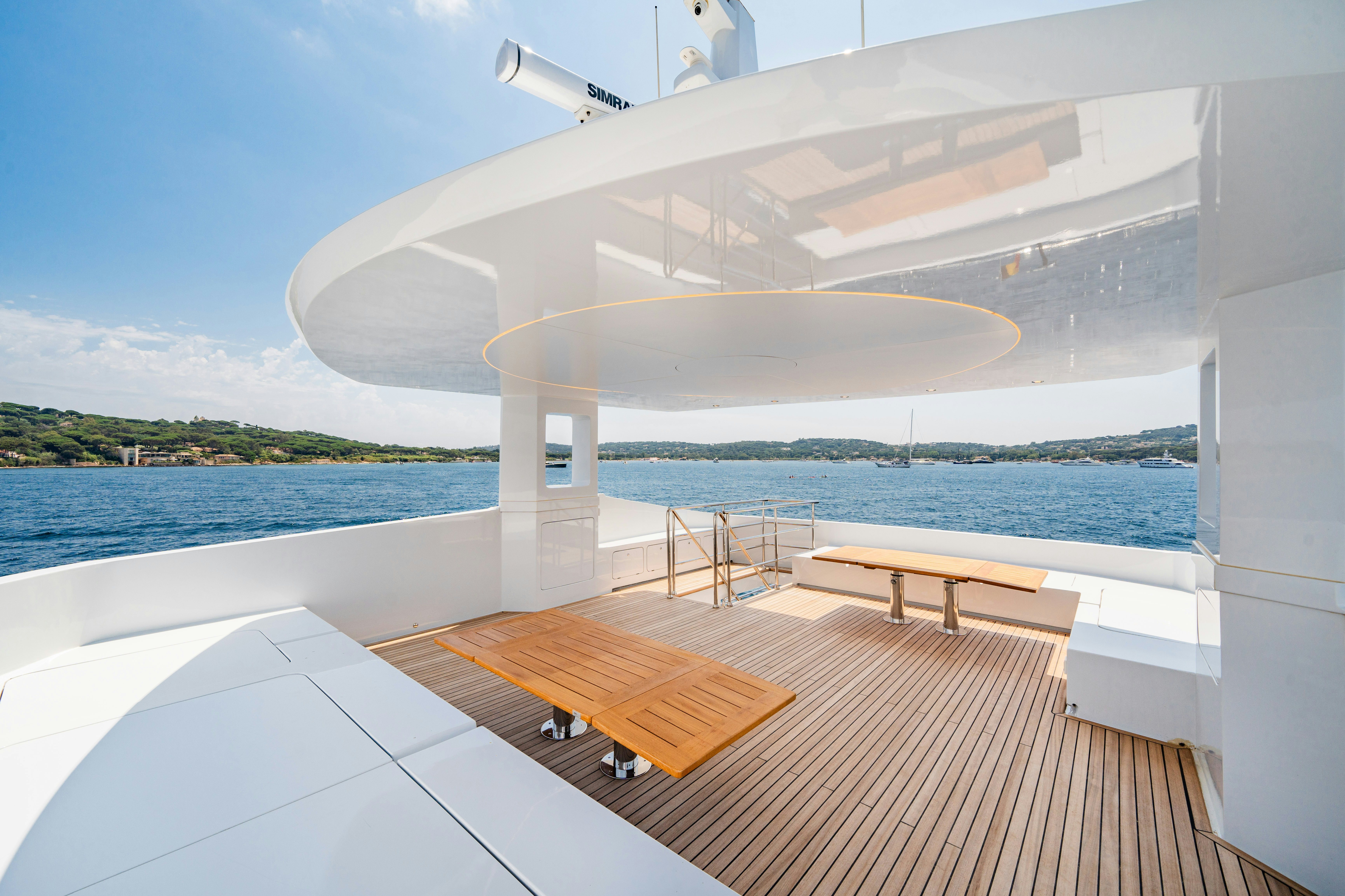 a room with a pool and a deck with a large pool and a large building with a large aboard ICE Yacht for Sale