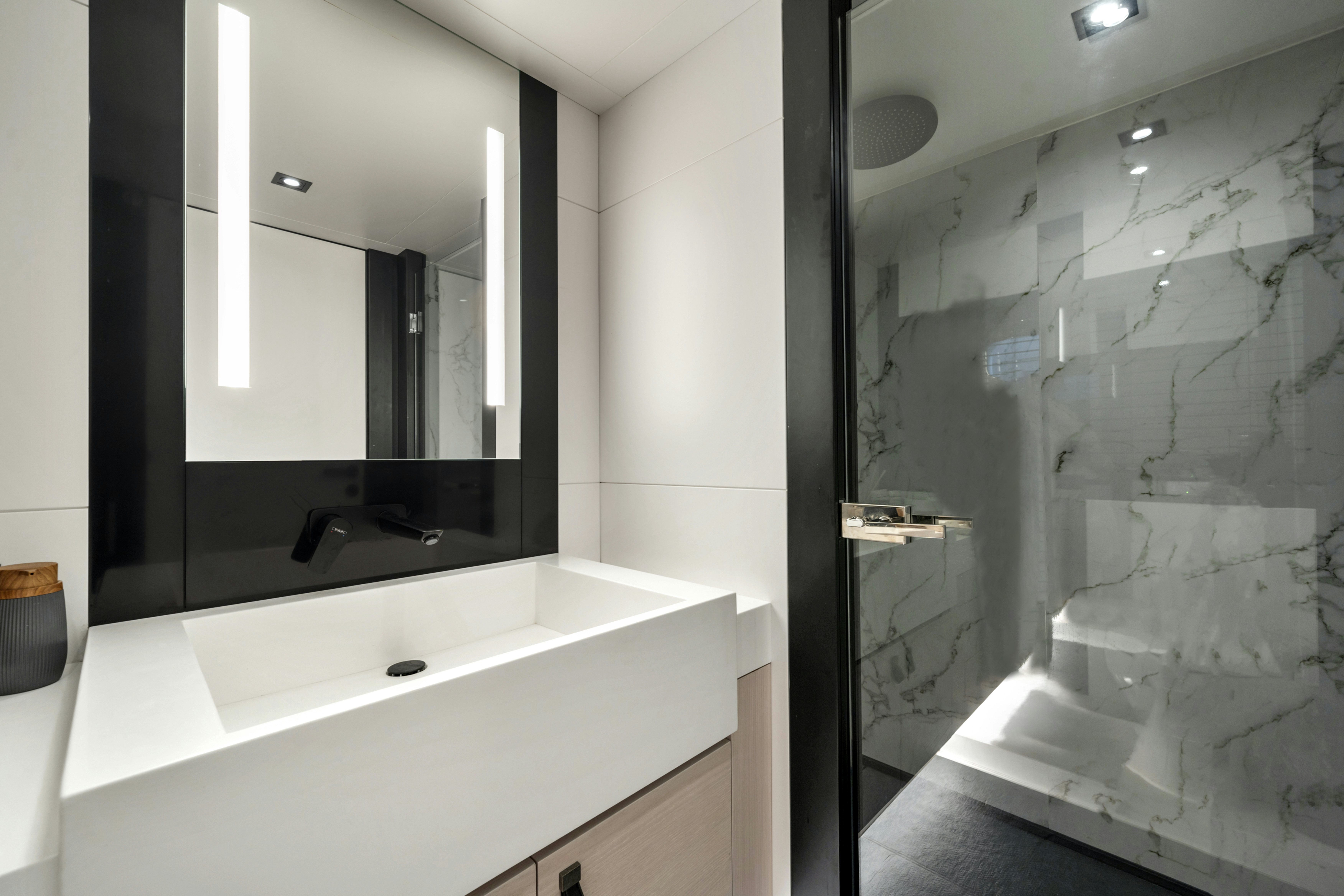 a bathroom with a glass shower aboard ICE Yacht for Sale