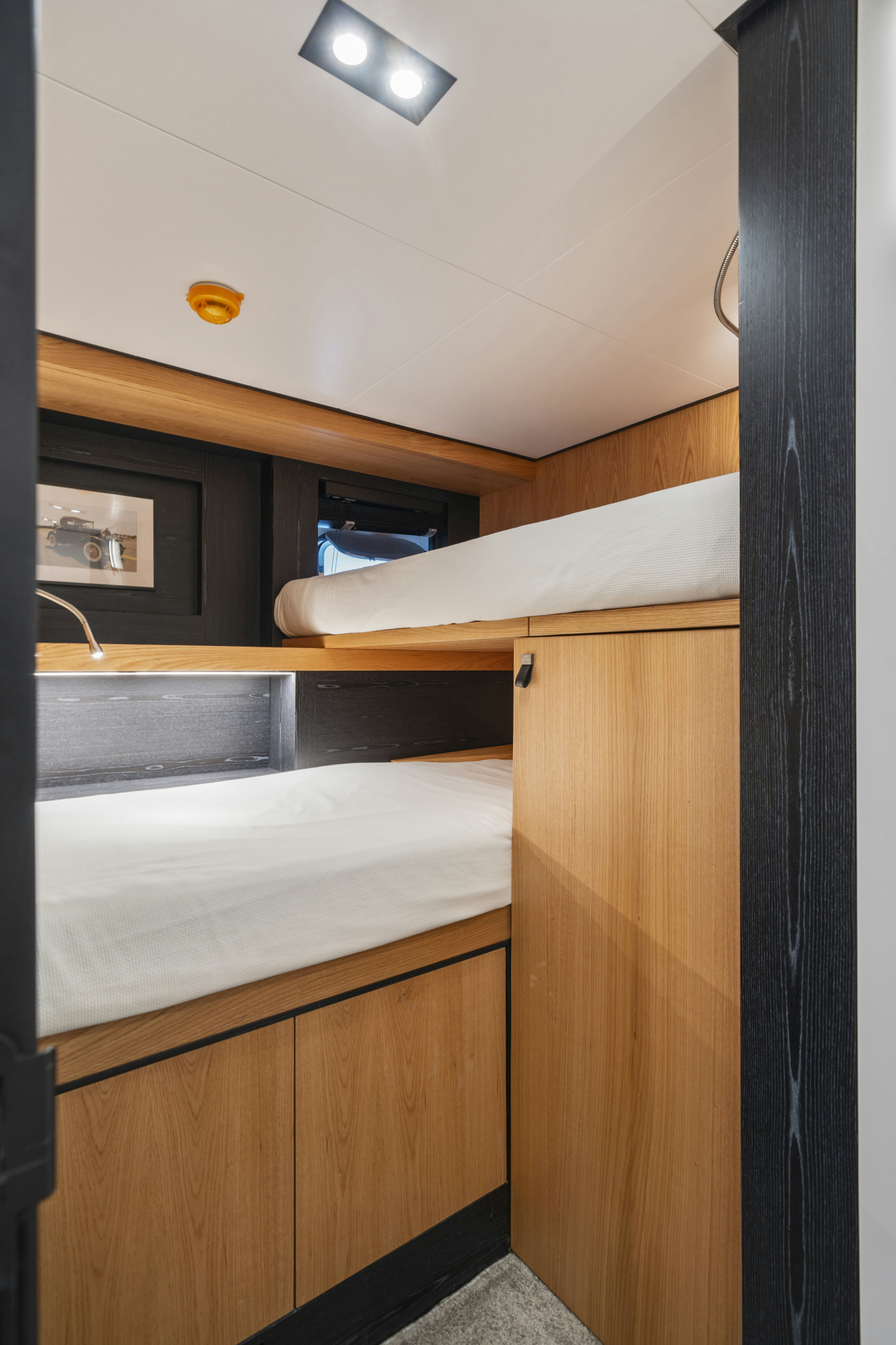 a room with a sink and a bunk bed aboard ICE Yacht for Sale