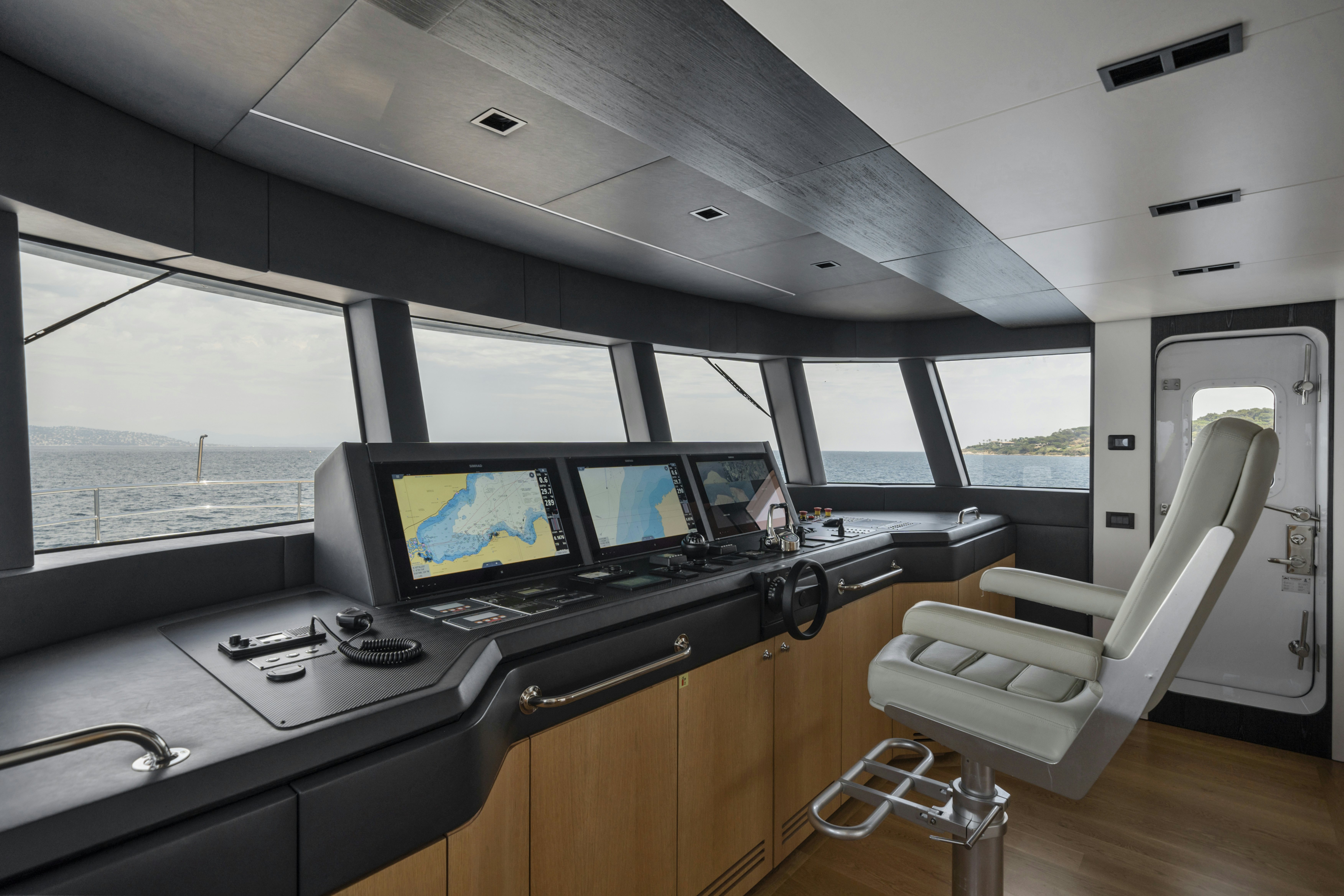 a room with a desk and a computer aboard ICE Yacht for Sale