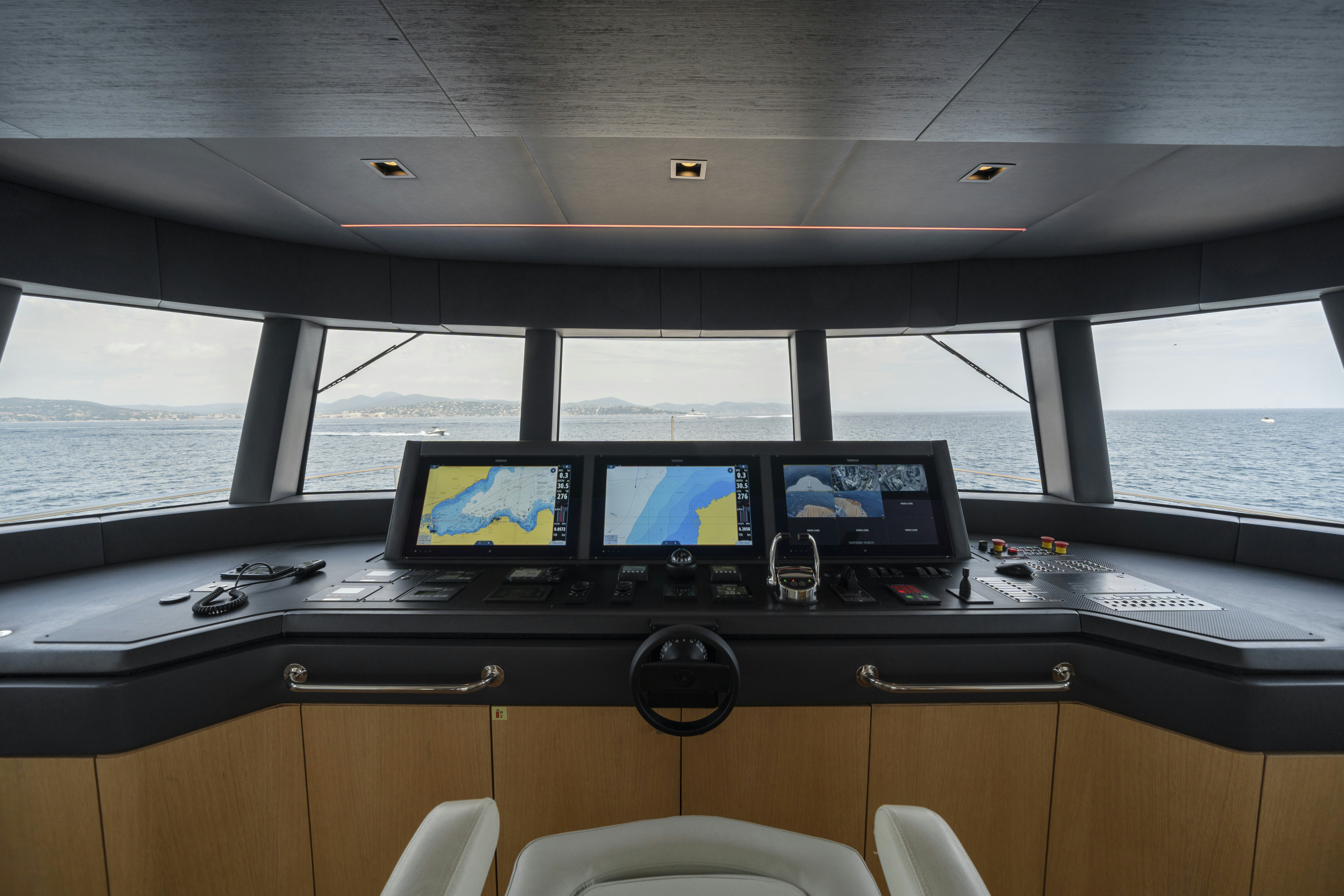 a control panel with monitors aboard ICE Yacht for Sale