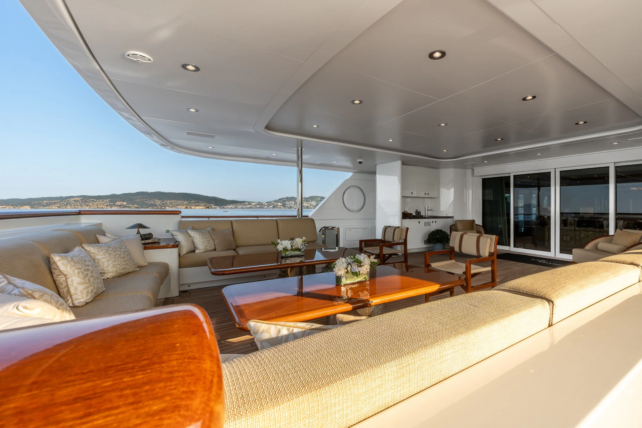 a living room with a large sofa aboard LADY MAXINE Yacht for Sale