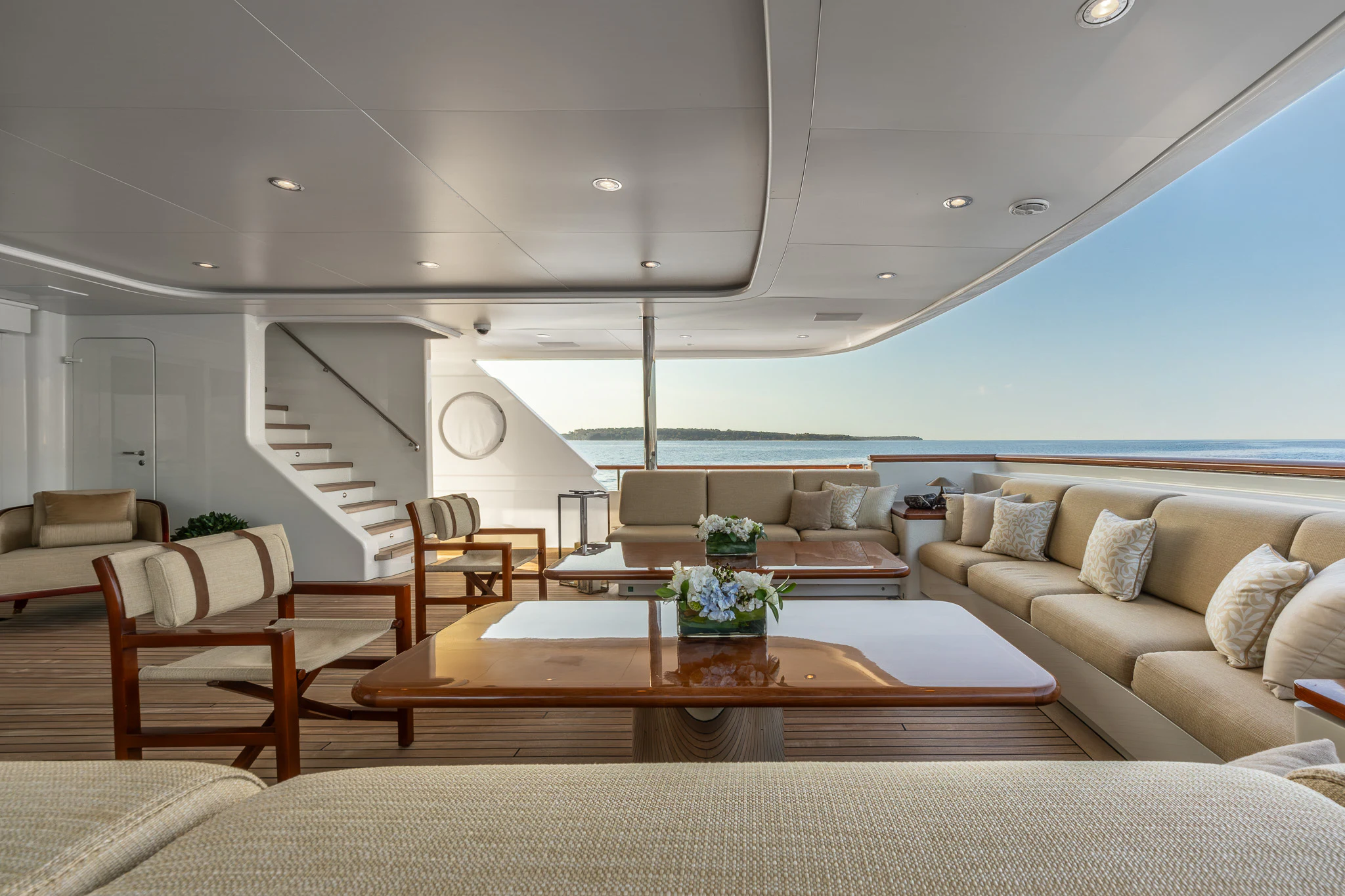 a living room with a large table aboard LADY MAXINE Yacht for Sale