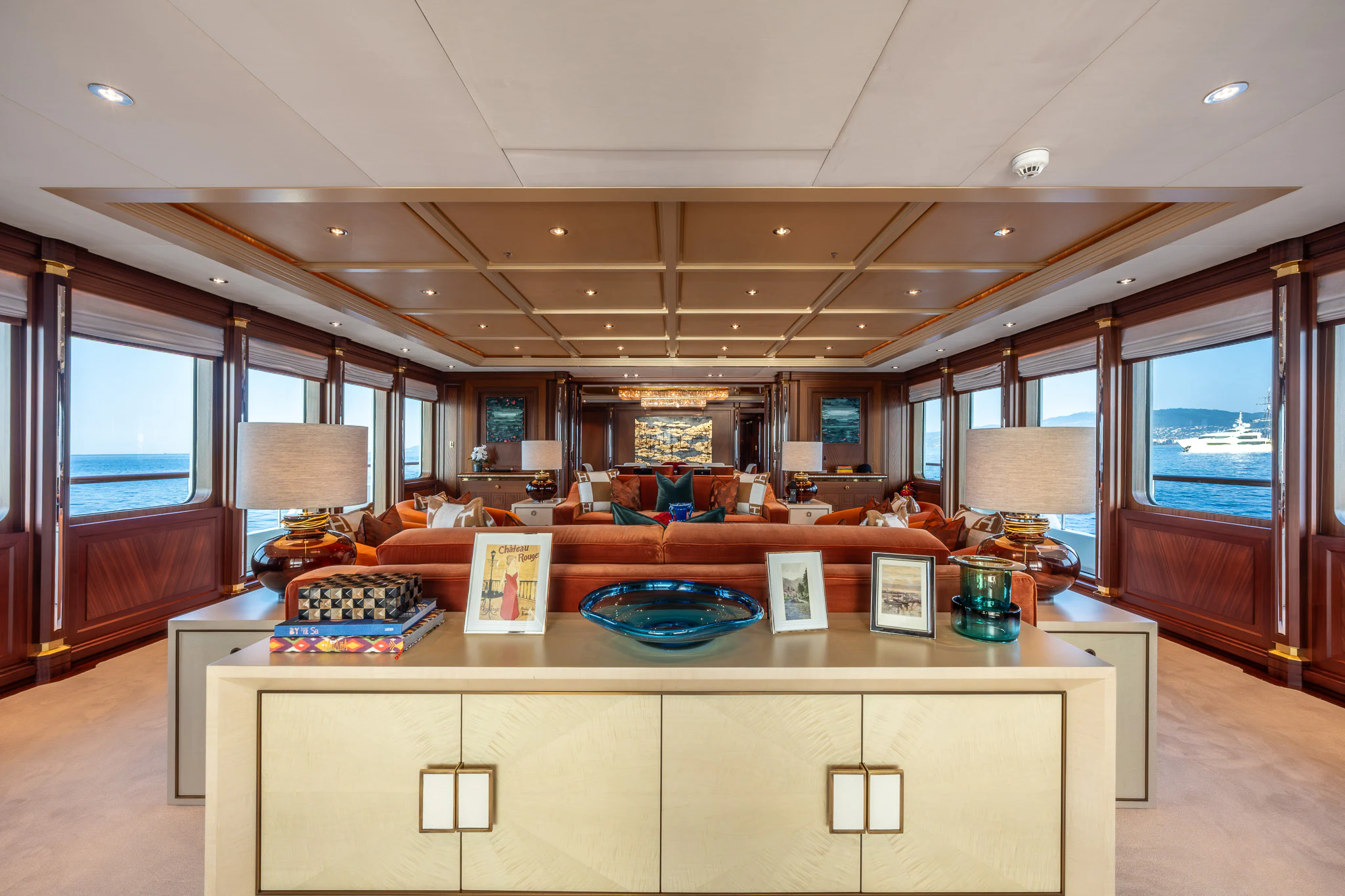 a room with a table and a tv aboard LADY MAXINE Yacht for Sale