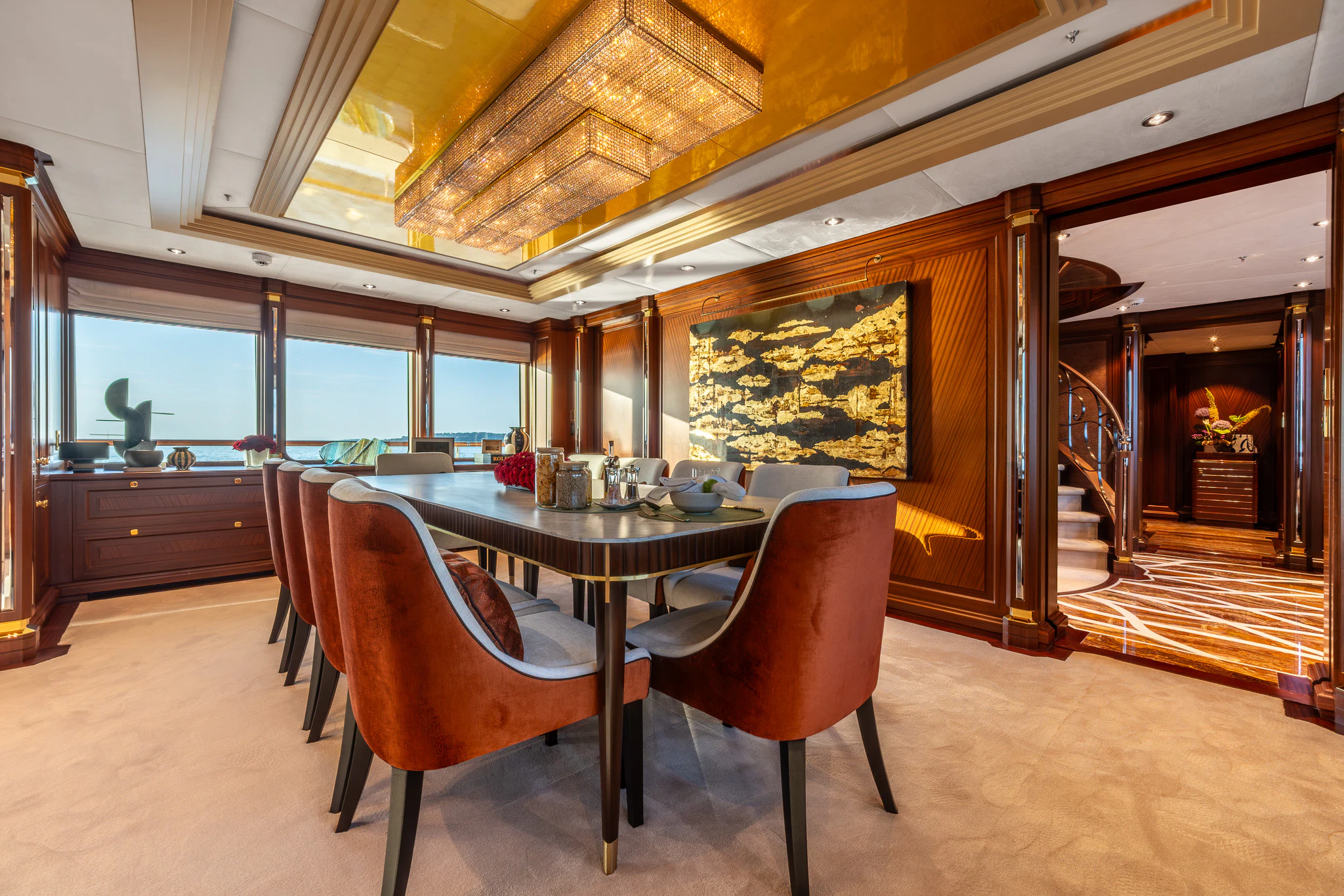 a large dining table in a large room with a large window aboard LADY MAXINE Yacht for Sale