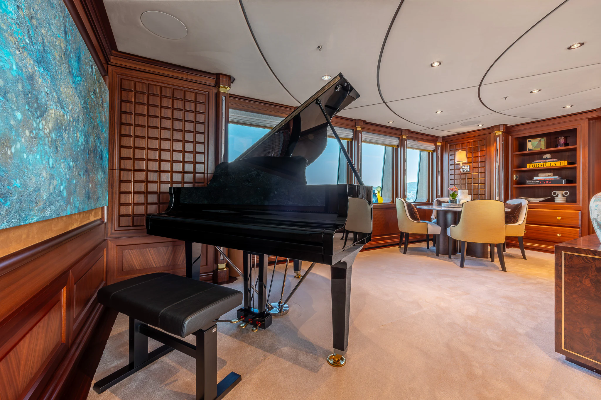 a black grand piano in a room aboard LADY MAXINE Yacht for Sale