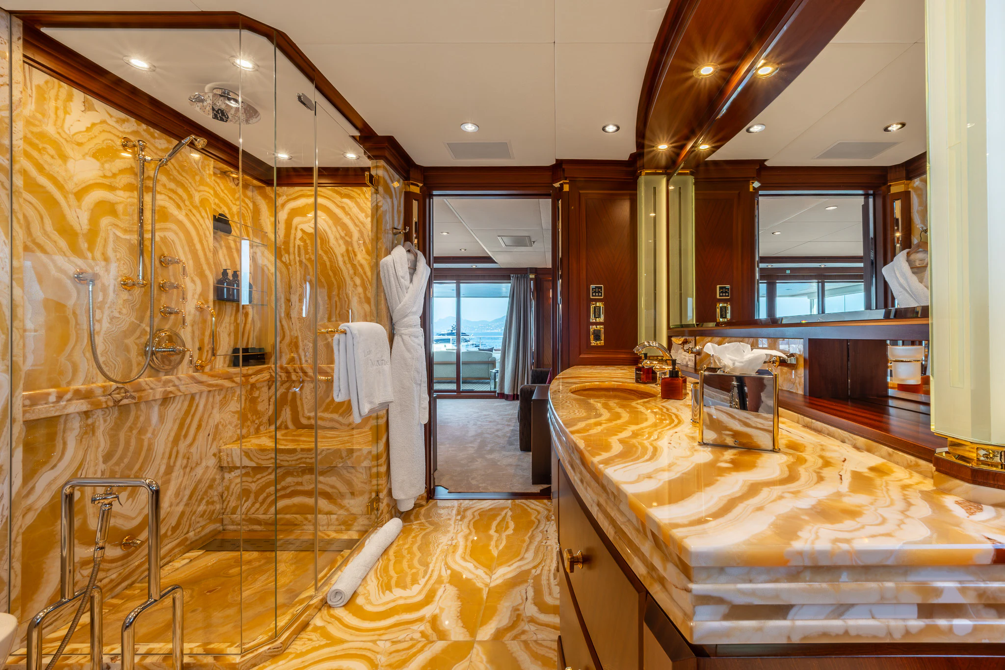 a room with a bed and a mirror aboard LADY MAXINE Yacht for Sale