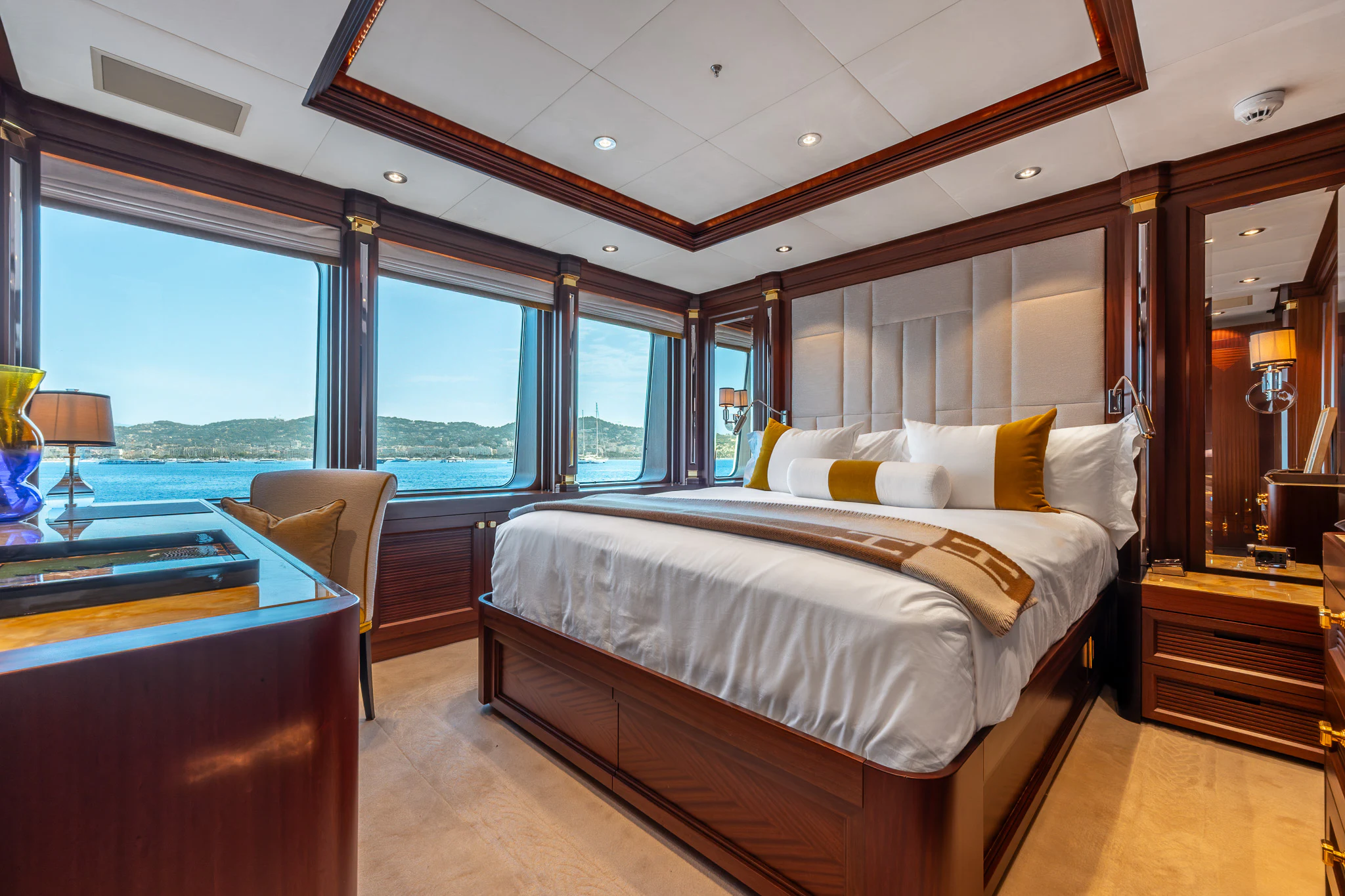 a bedroom with a large bed aboard LADY MAXINE Yacht for Sale