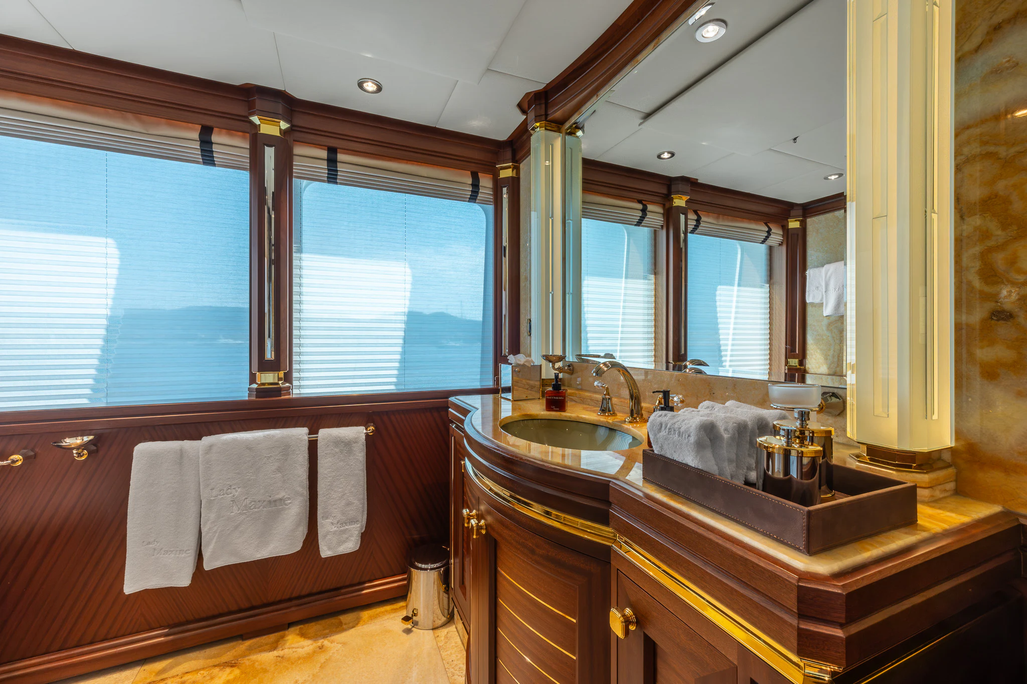 a bathroom with a large mirror aboard LADY MAXINE Yacht for Sale