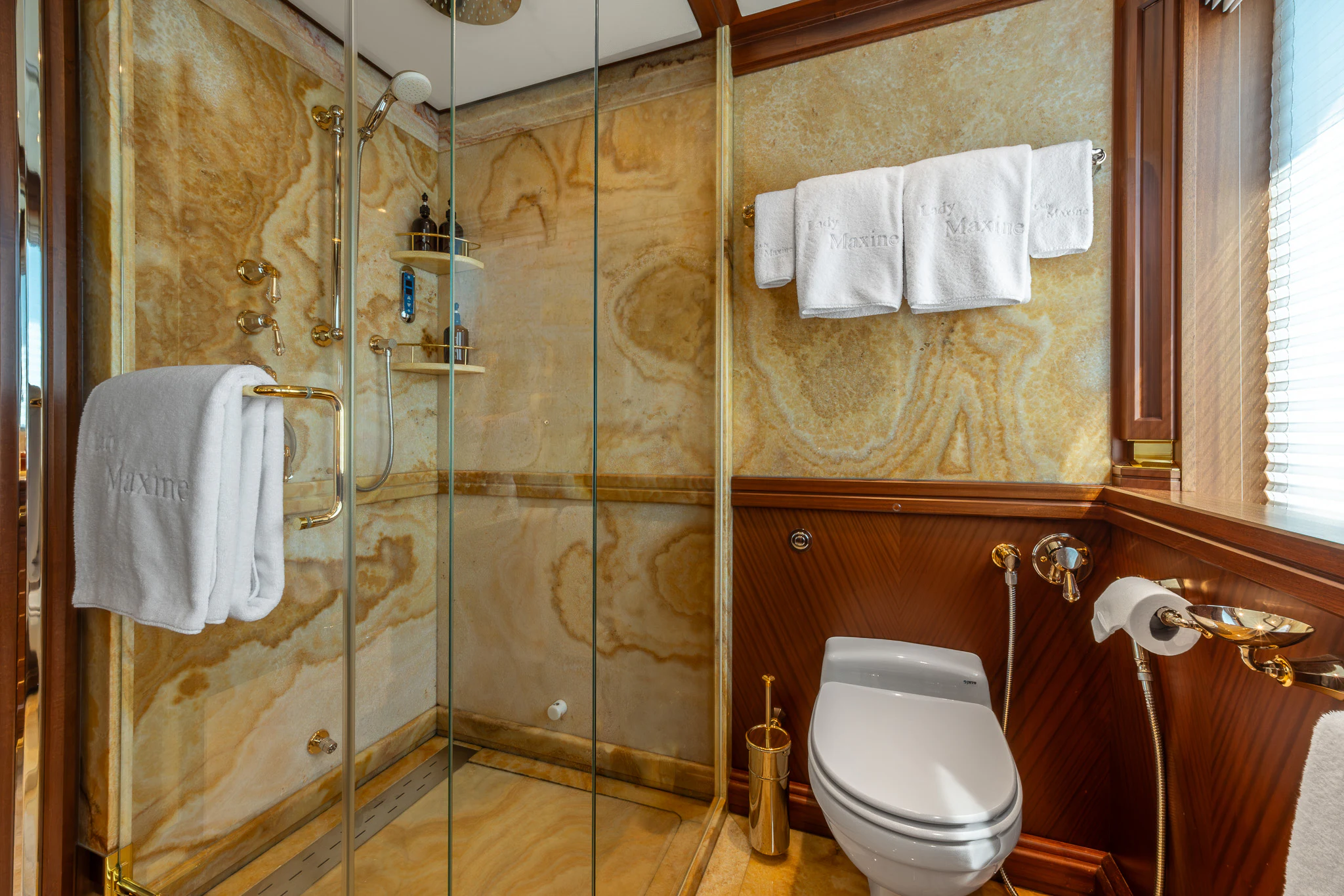 a bathroom with a glass shower aboard LADY MAXINE Yacht for Sale