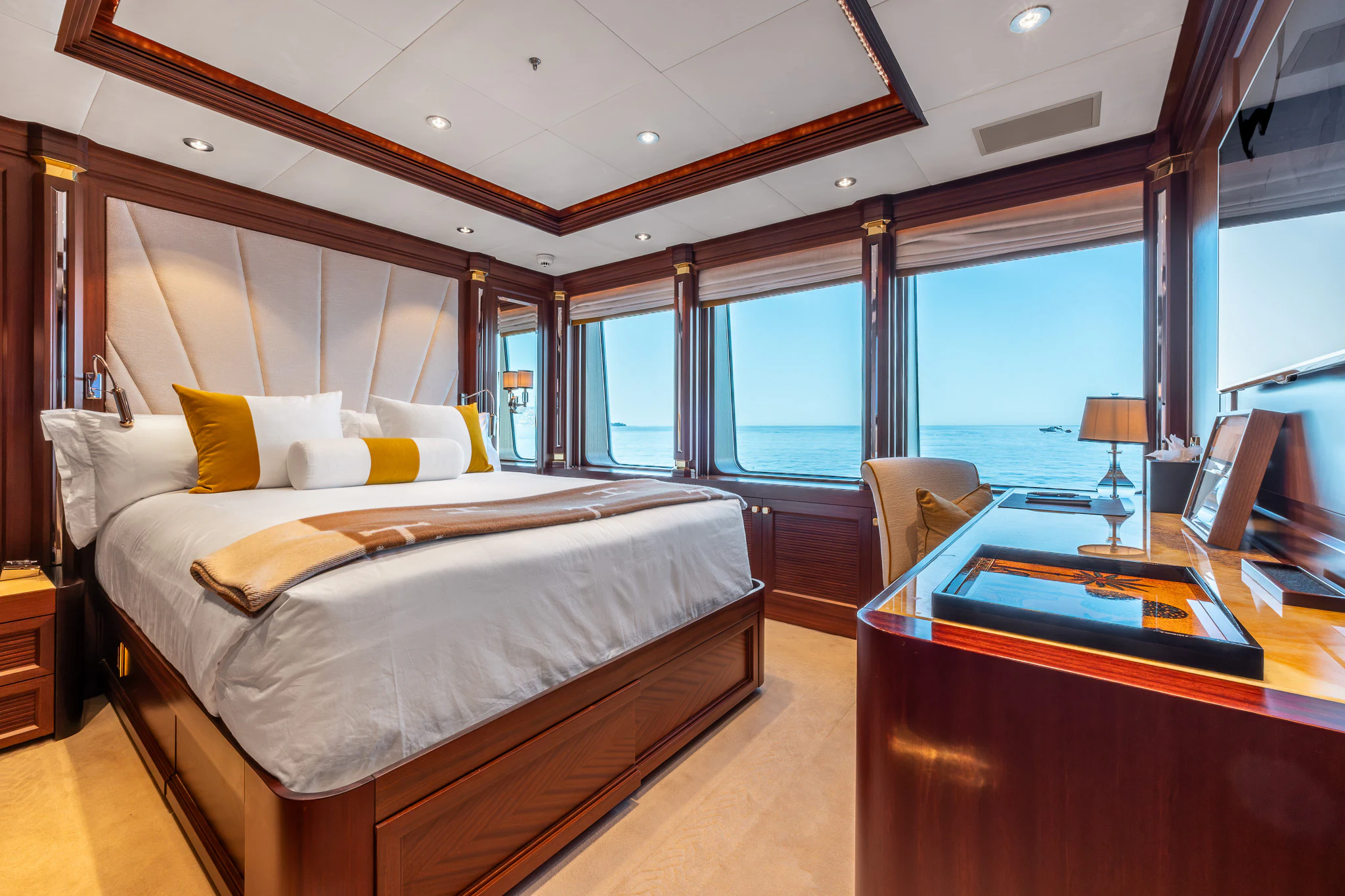 a room with a bed and a desk aboard LADY MAXINE Yacht for Sale