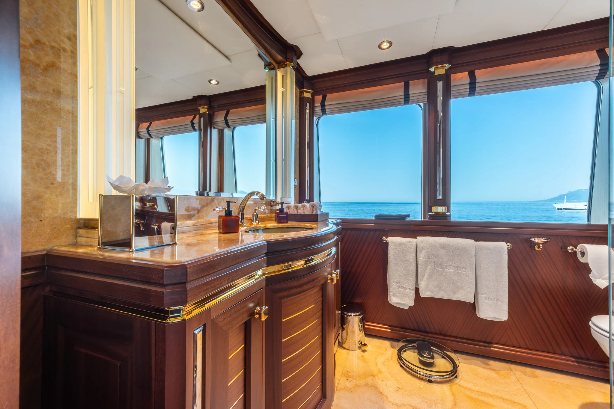 a bathroom with a large window aboard LADY MAXINE Yacht for Sale