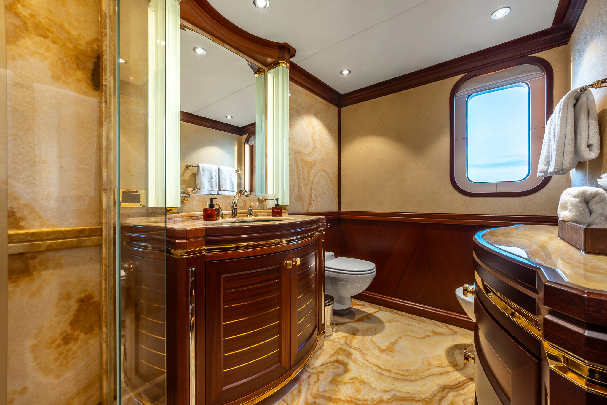 a bathroom with a glass shower aboard LADY MAXINE Yacht for Sale