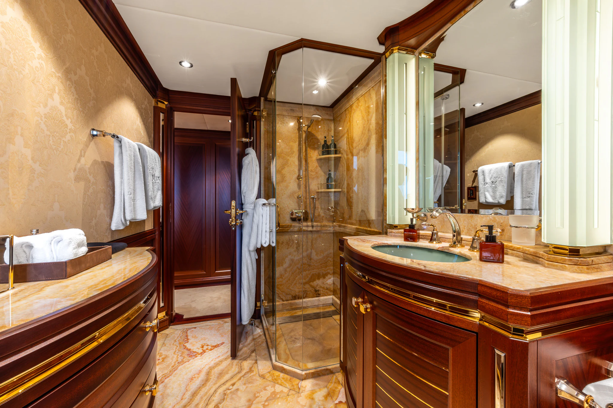 a bathroom with a glass shower aboard LADY MAXINE Yacht for Sale