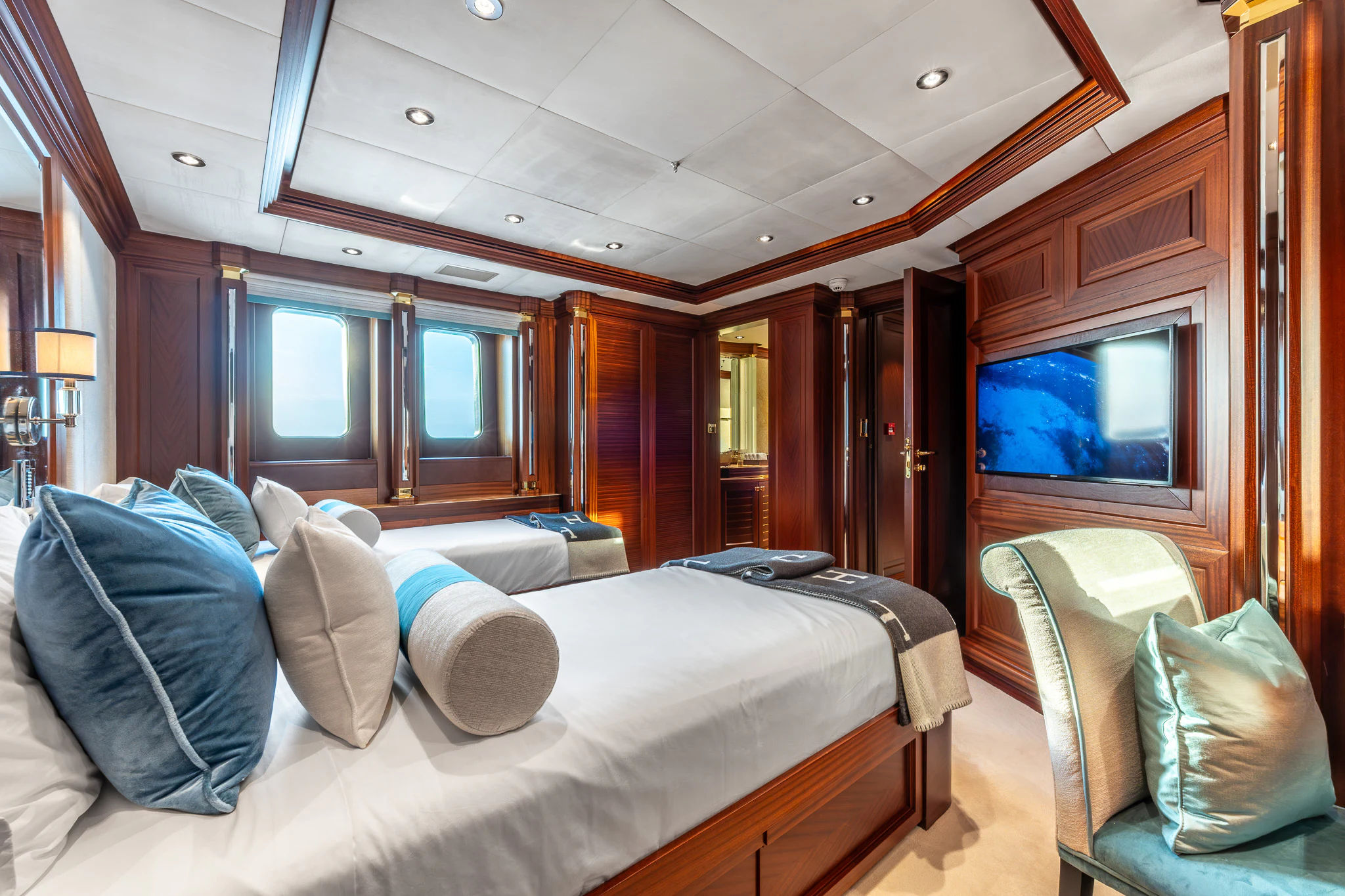 a bedroom with a bed and a television aboard LADY MAXINE Yacht for Sale