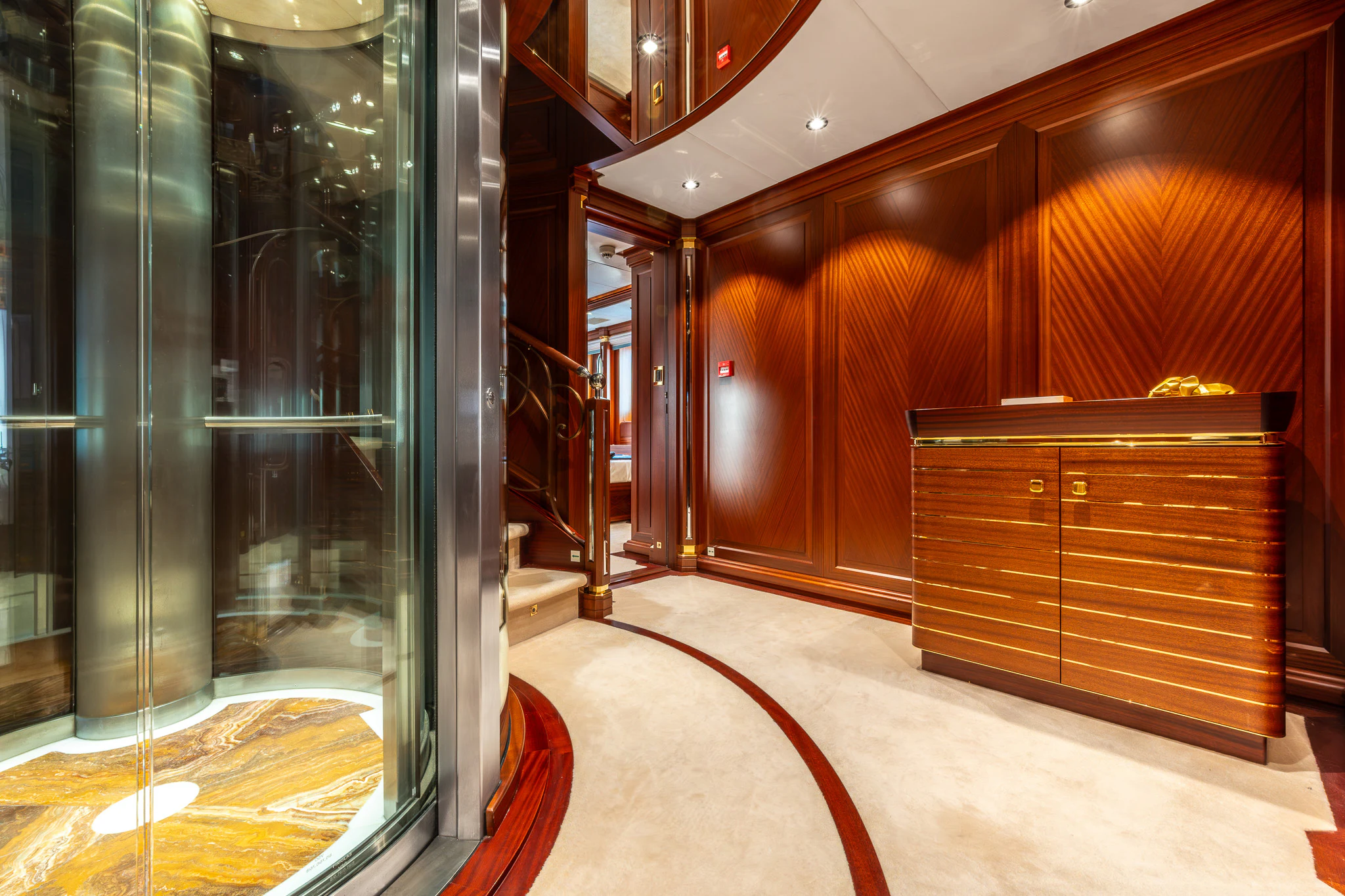 a room with wooden cabinets aboard LADY MAXINE Yacht for Sale