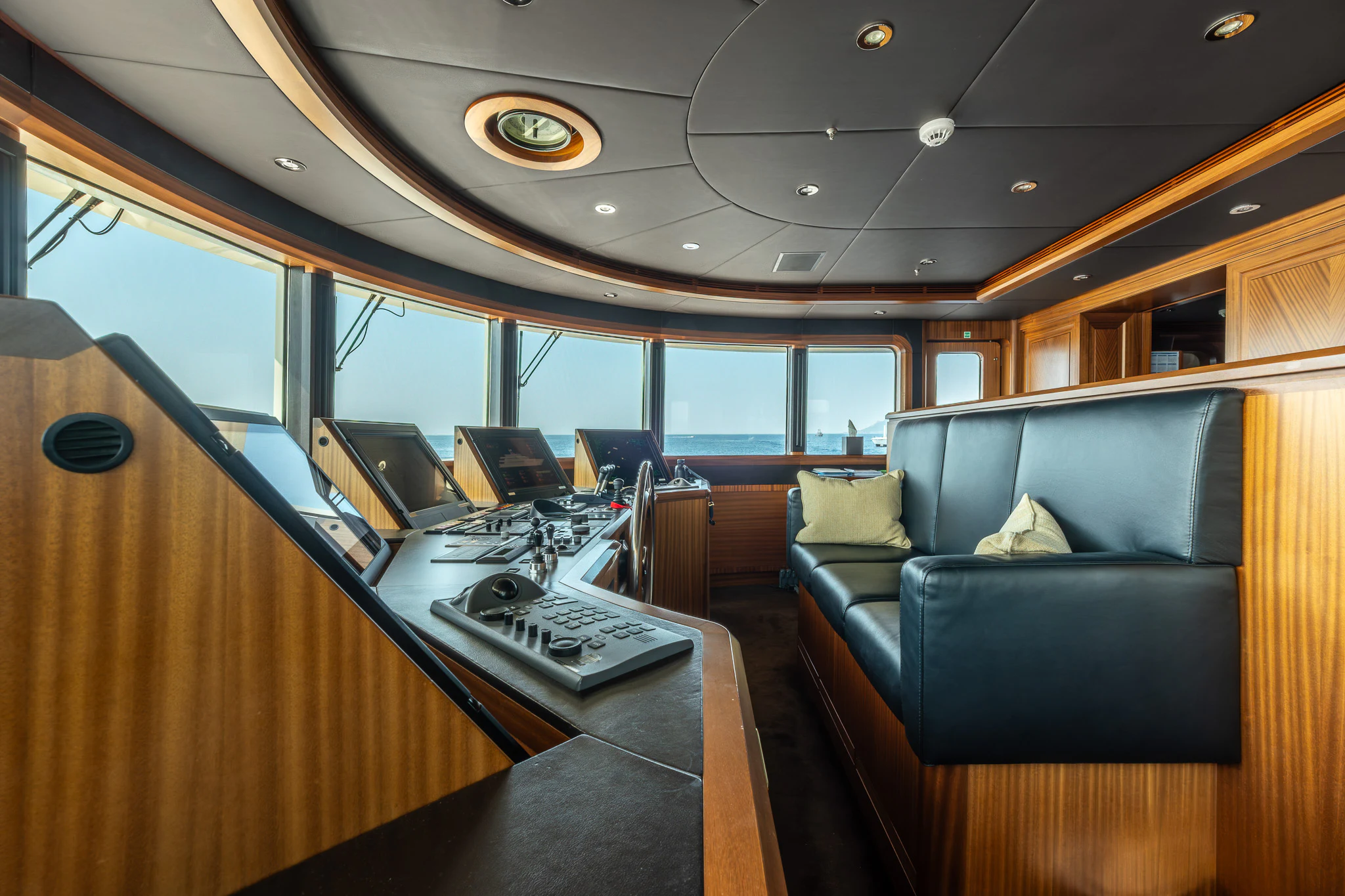inside of a vehicle with a desk and a computer on a table aboard LADY MAXINE Yacht for Sale