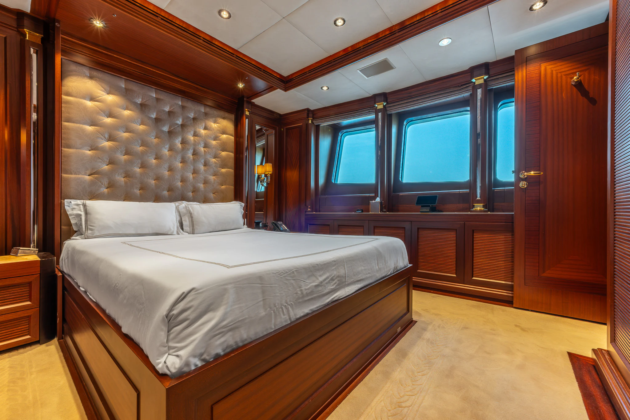a bedroom with a large bed aboard LADY MAXINE Yacht for Sale