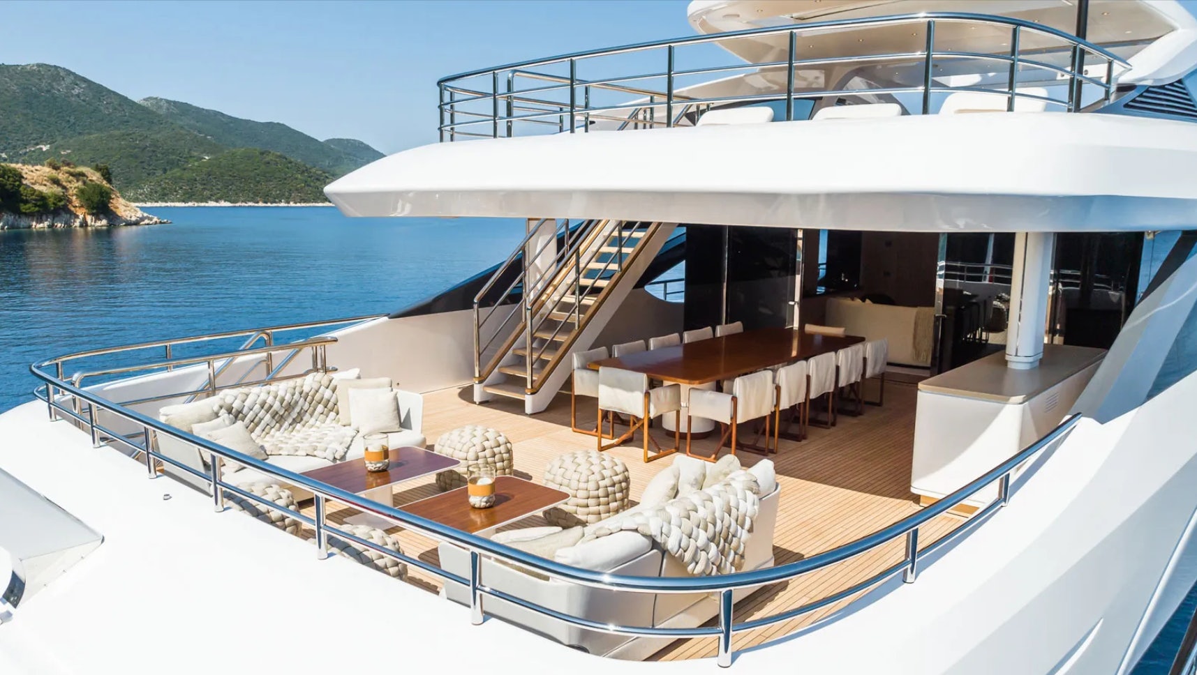 a large white boat on a body of water aboard ALUNYA Yacht for Charter