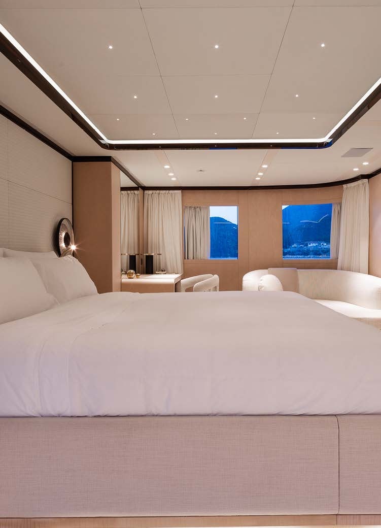 a bed with white sheets aboard ALUNYA Yacht for Charter