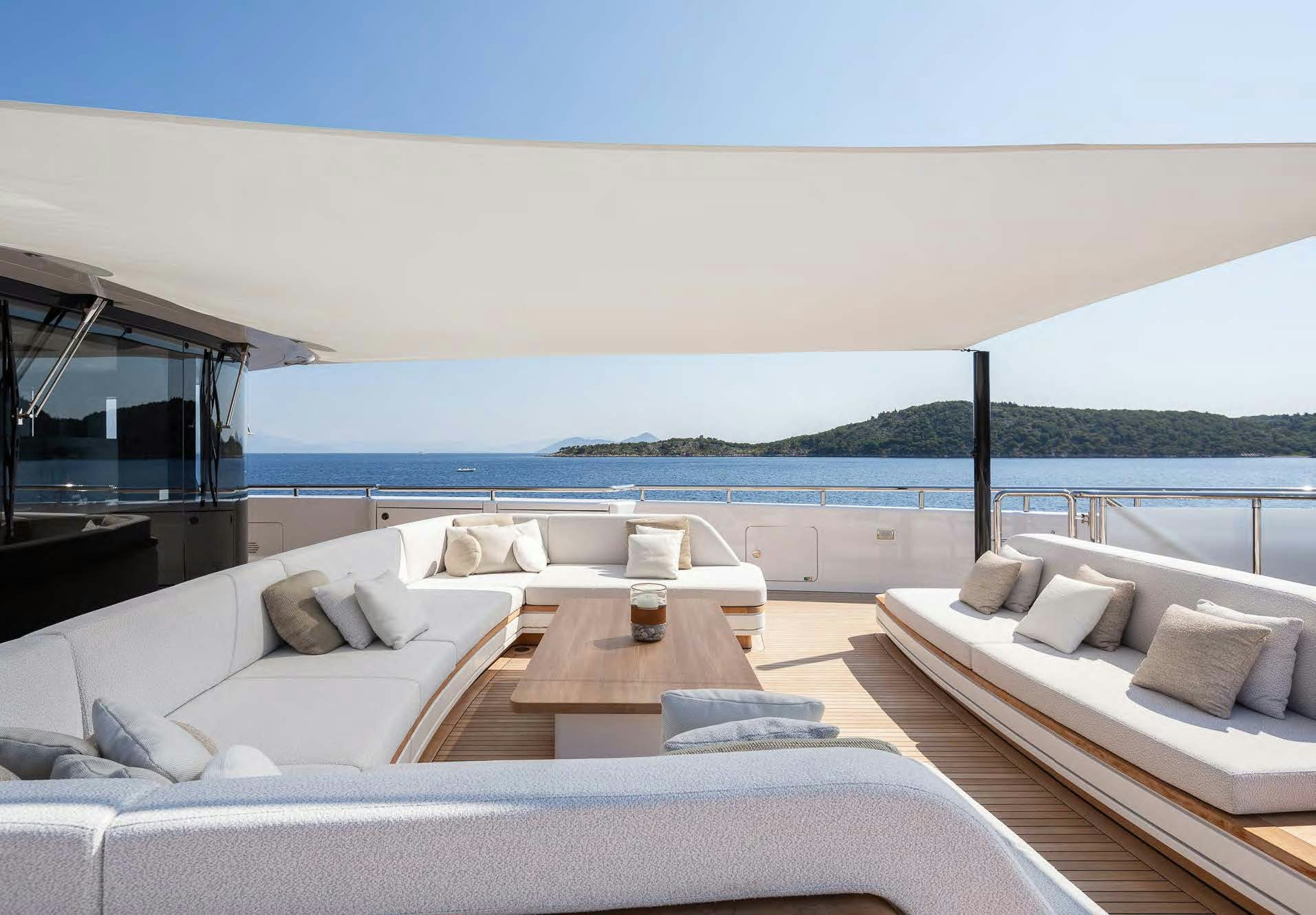 a living room with a large body of water aboard ALUNYA Yacht for Charter