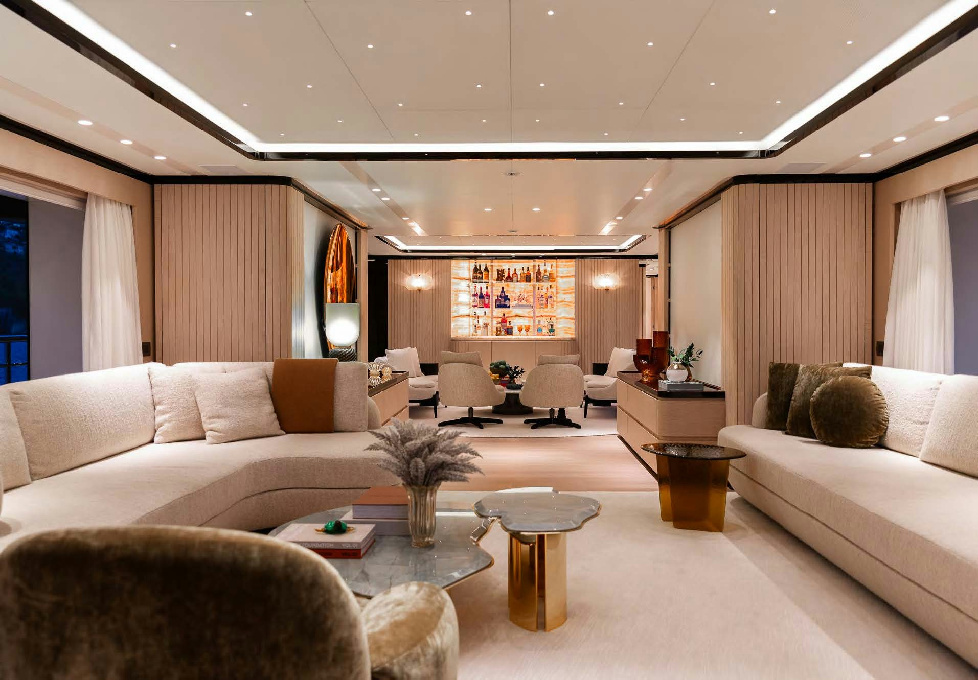 a living room with white couches aboard ALUNYA Yacht for Charter
