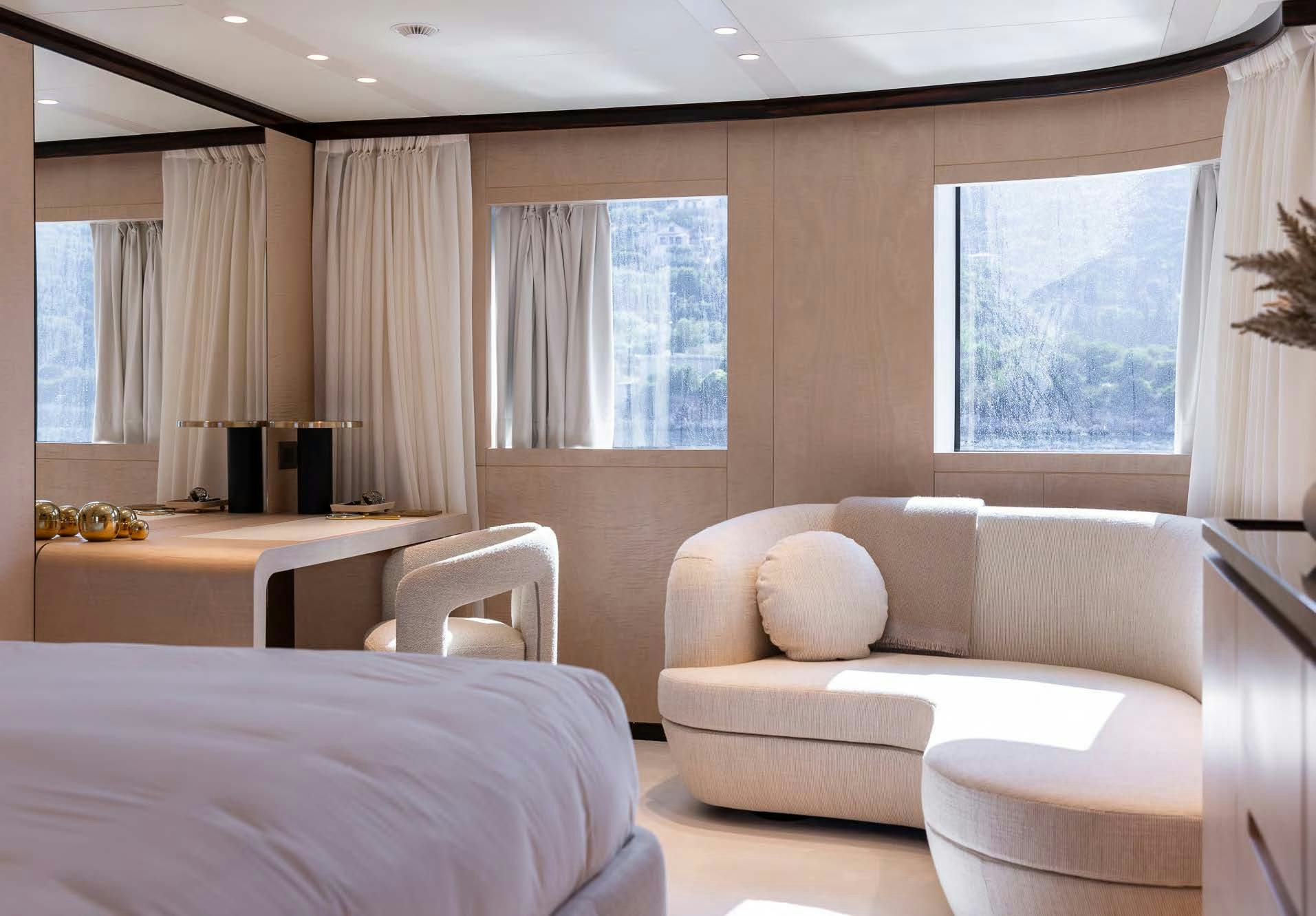 a room with a bed and a couch aboard ALUNYA Yacht for Charter