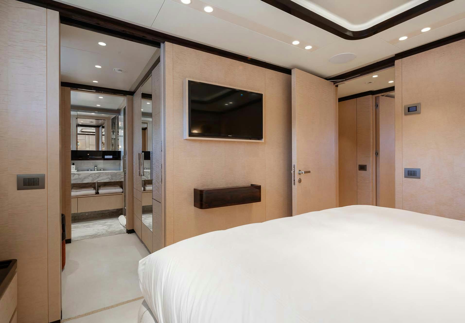 a hotel room with a bed aboard ALUNYA Yacht for Charter