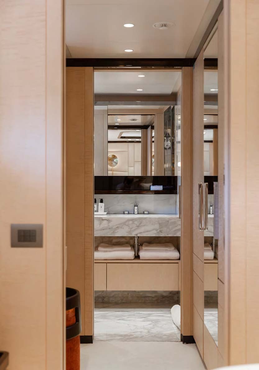 a bathroom with a large mirror aboard ALUNYA Yacht for Charter
