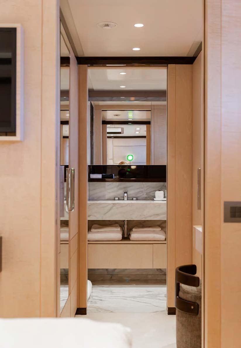 a bathroom with a glass shower aboard ALUNYA Yacht for Charter