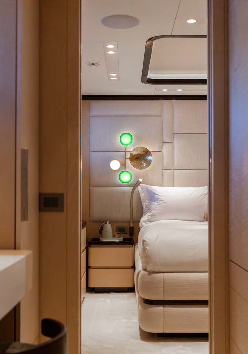 a room with a bed and a sink aboard ALUNYA Yacht for Charter
