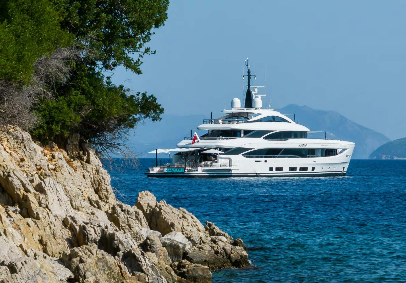 a white boat on the water aboard ALUNYA Yacht for Charter