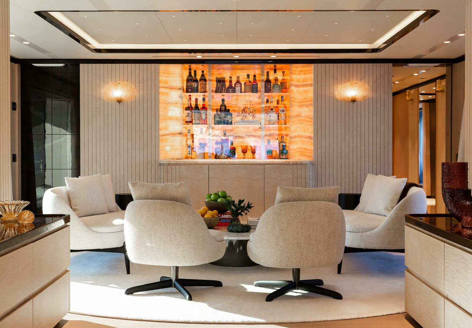 a room with a couch and a table with chairs aboard ALUNYA Yacht for Charter