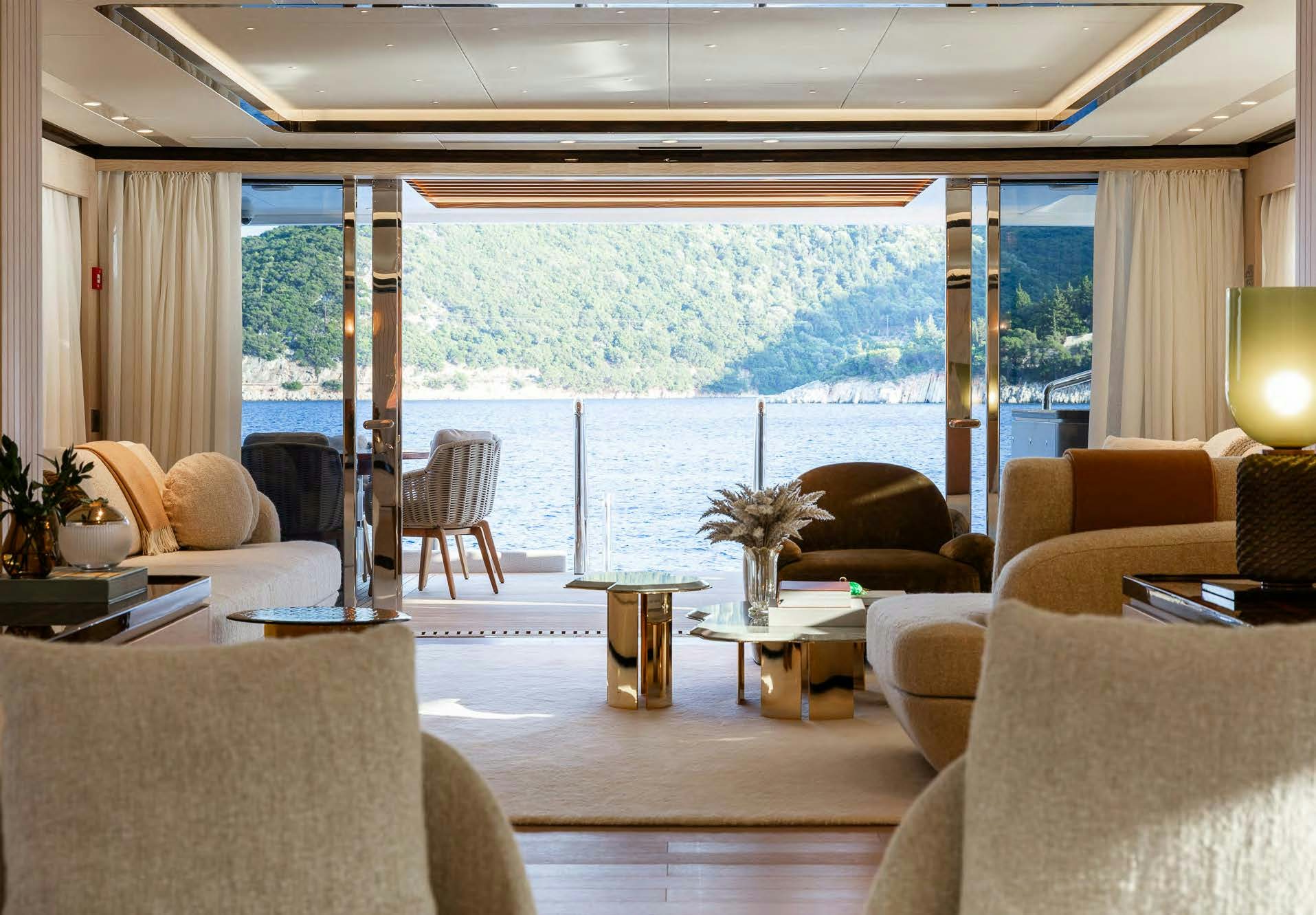 a living room with a large window aboard ALUNYA Yacht for Charter