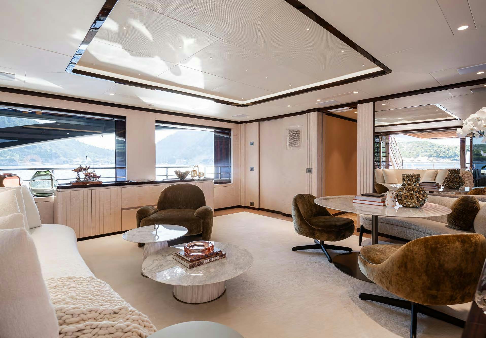a living room with a large window aboard ALUNYA Yacht for Charter