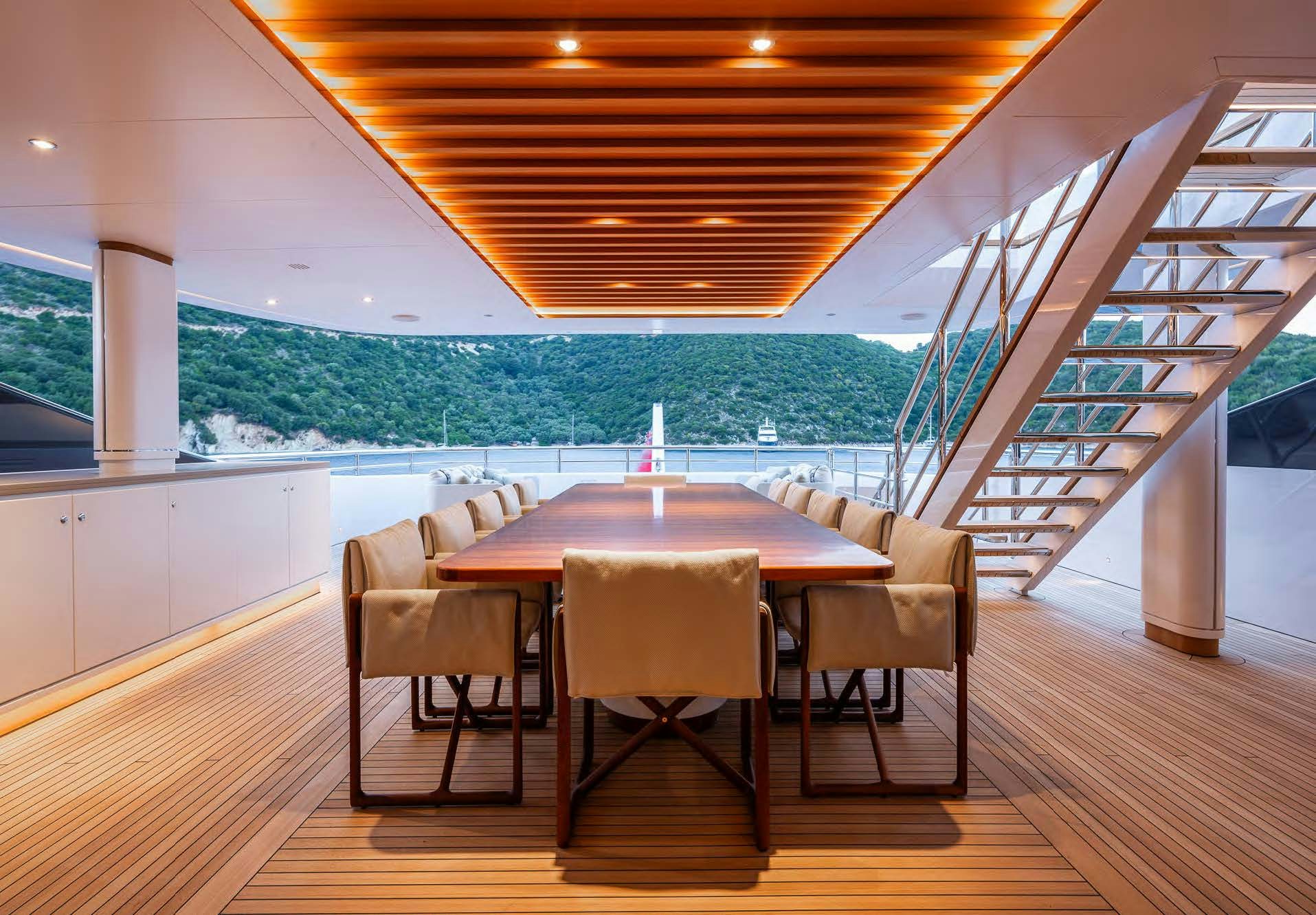 a table and chairs on a deck aboard ALUNYA Yacht for Charter