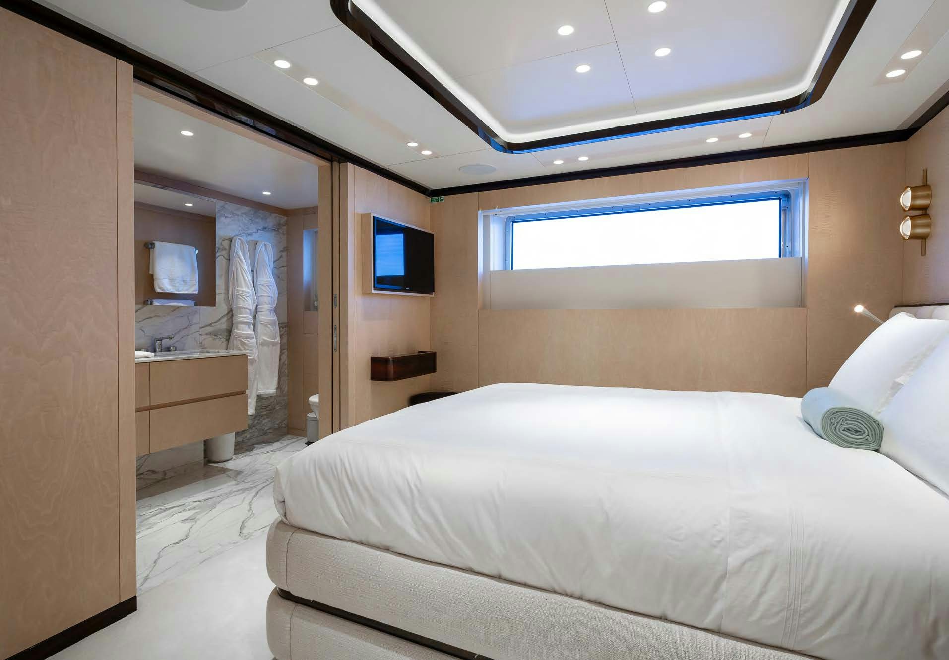 a hotel room with a bed aboard ALUNYA Yacht for Charter