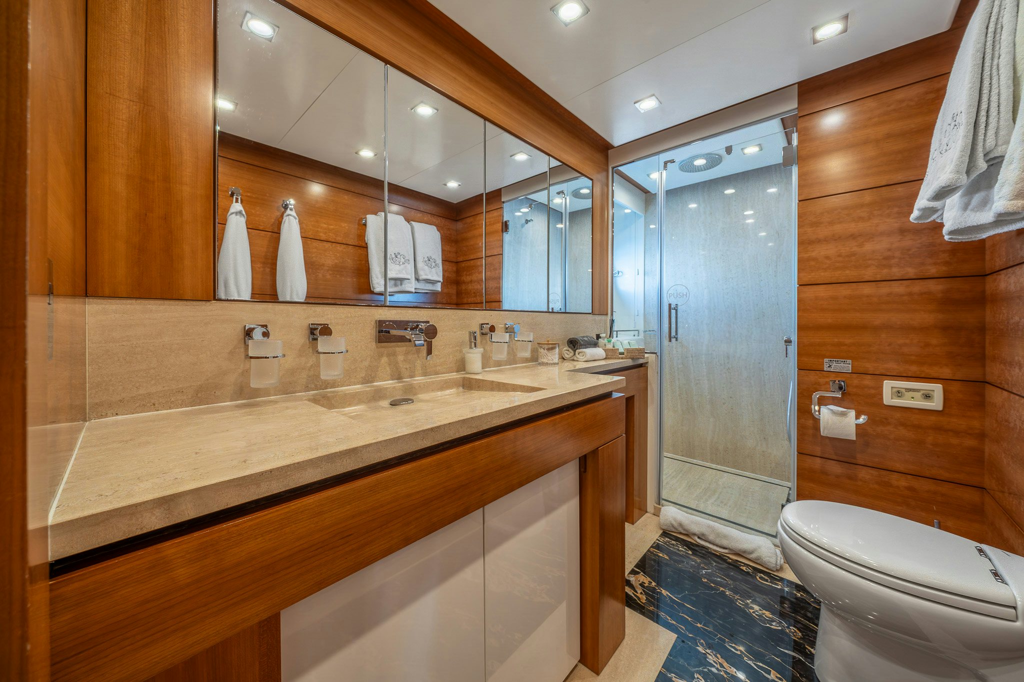 a bathroom with a countertop sink and a shower aboard ARION Yacht for Sale