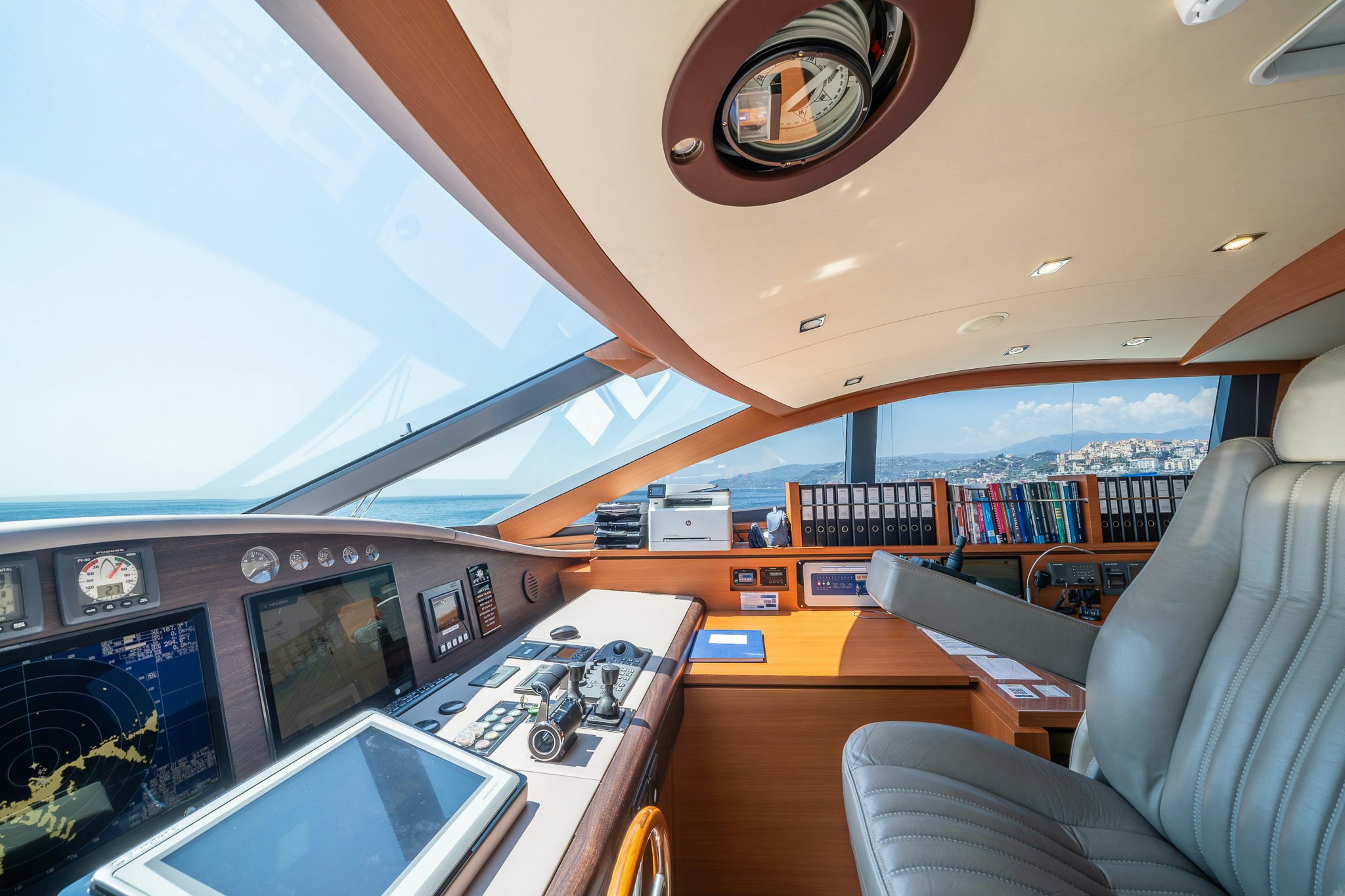 inside of a building with a large window and a view of the ocean aboard ARION Yacht for Sale
