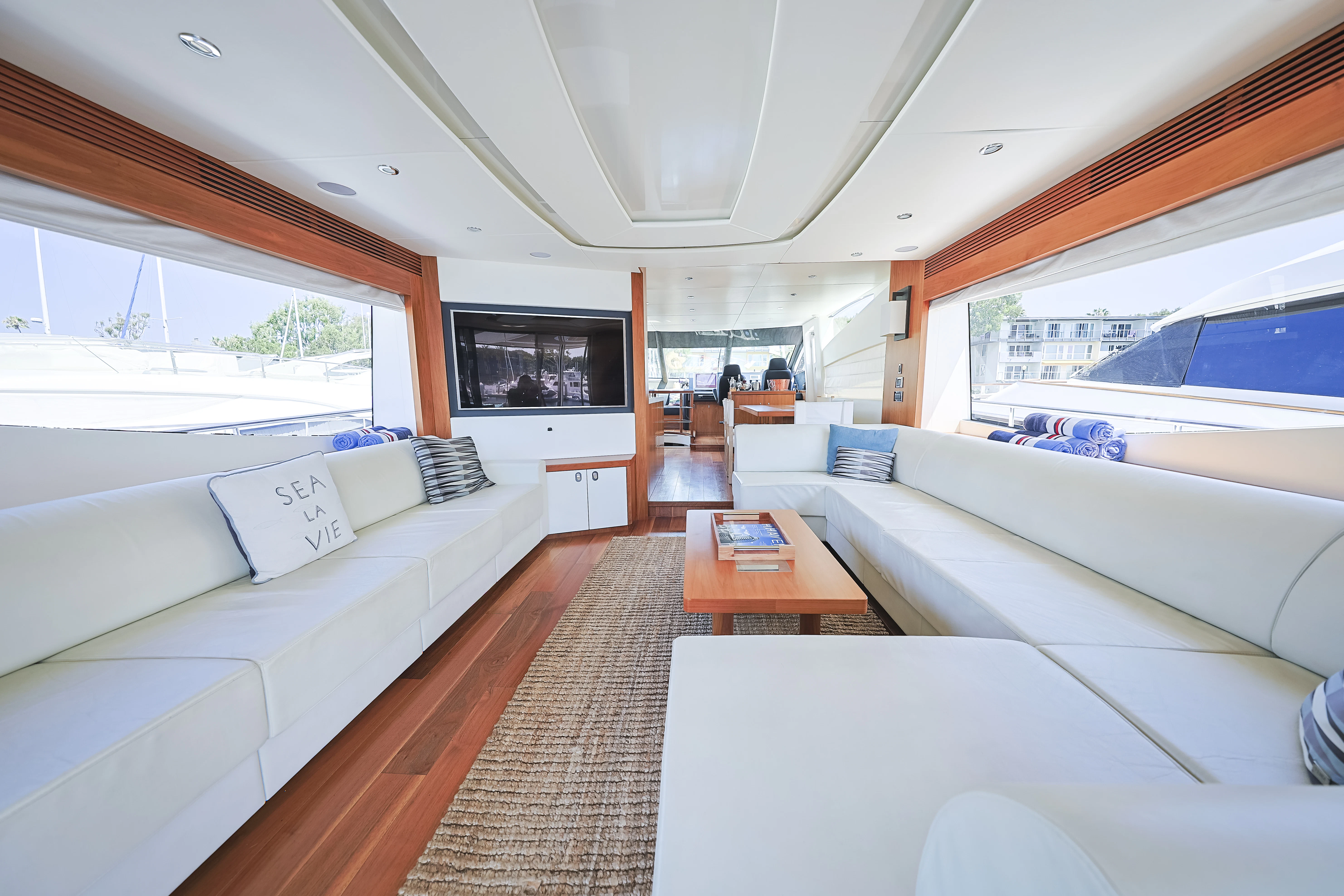 a living room with a large window aboard SEA LA VIE Yacht for Sale