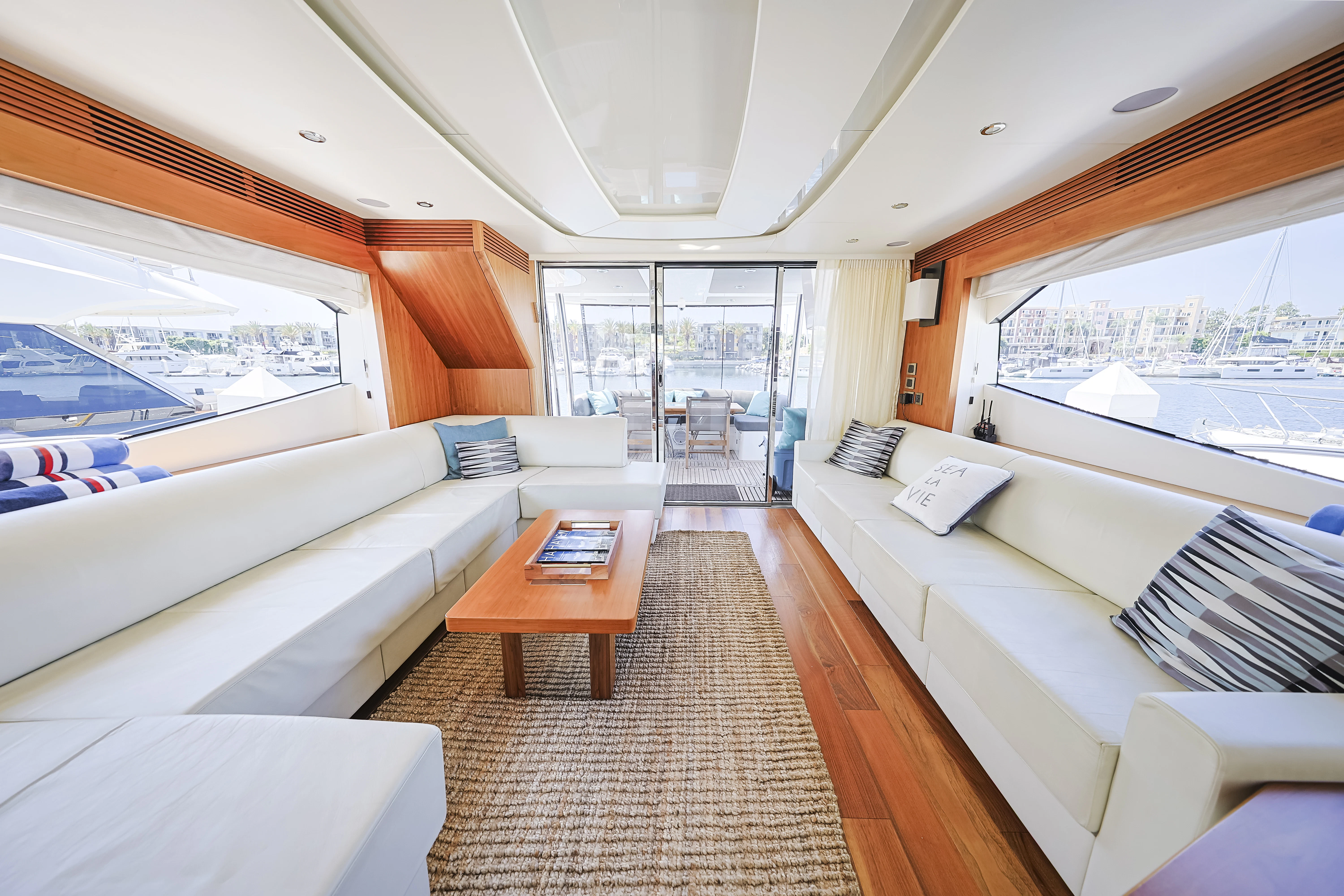 a living room with a large window aboard SEA LA VIE Yacht for Sale