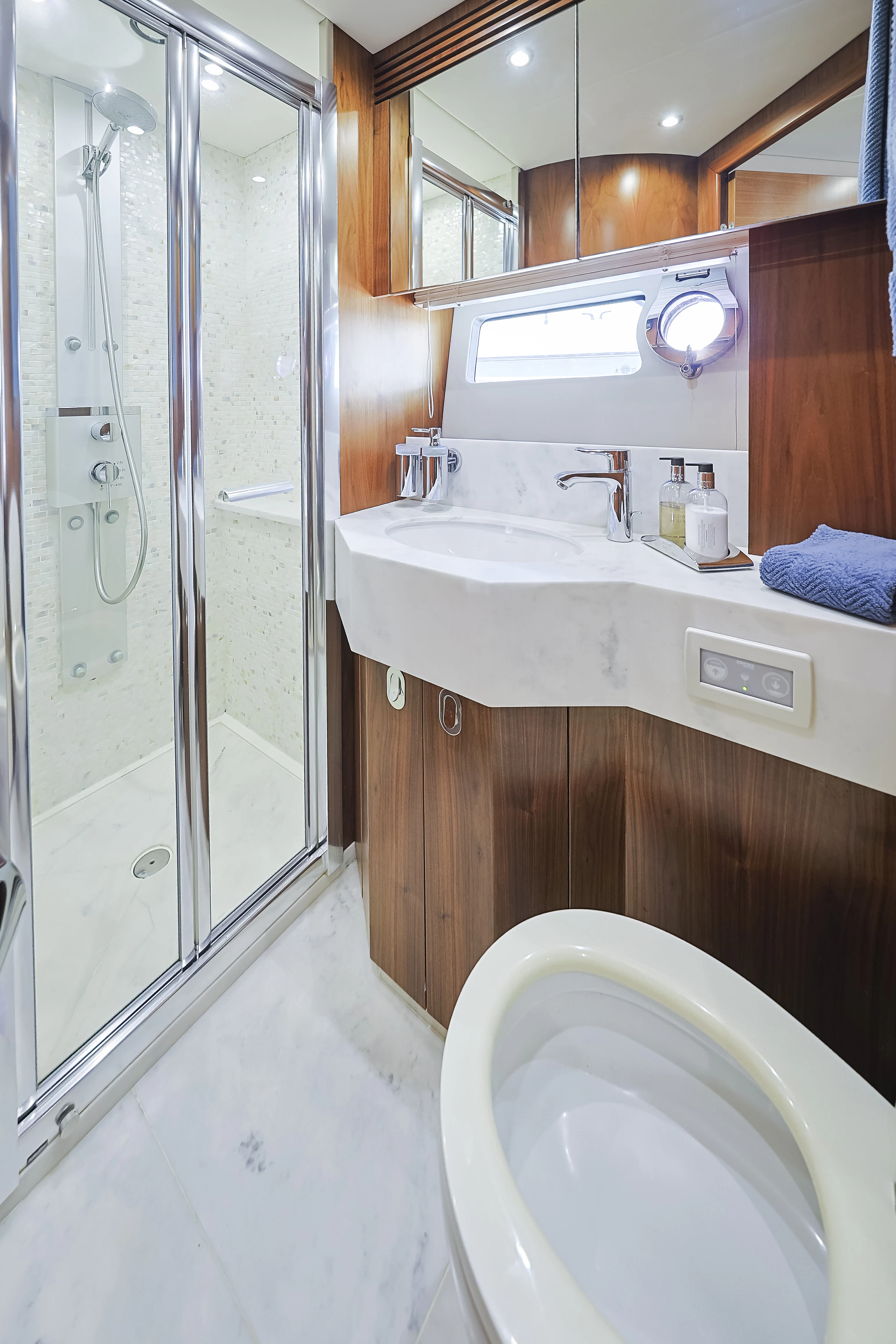 a bathroom with a glass shower door aboard SEA LA VIE Yacht for Sale