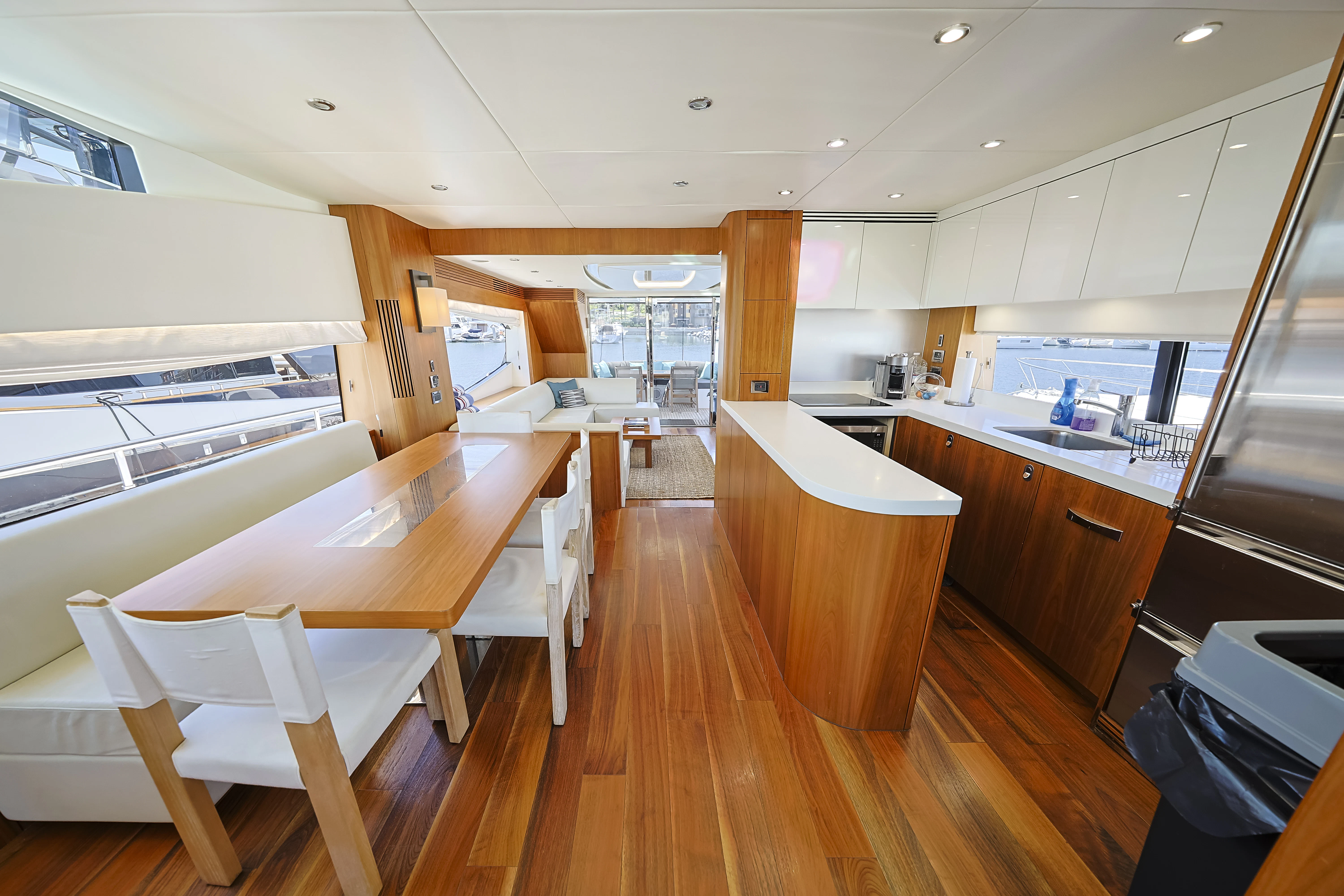 a kitchen with a table and chairs aboard SEA LA VIE Yacht for Sale