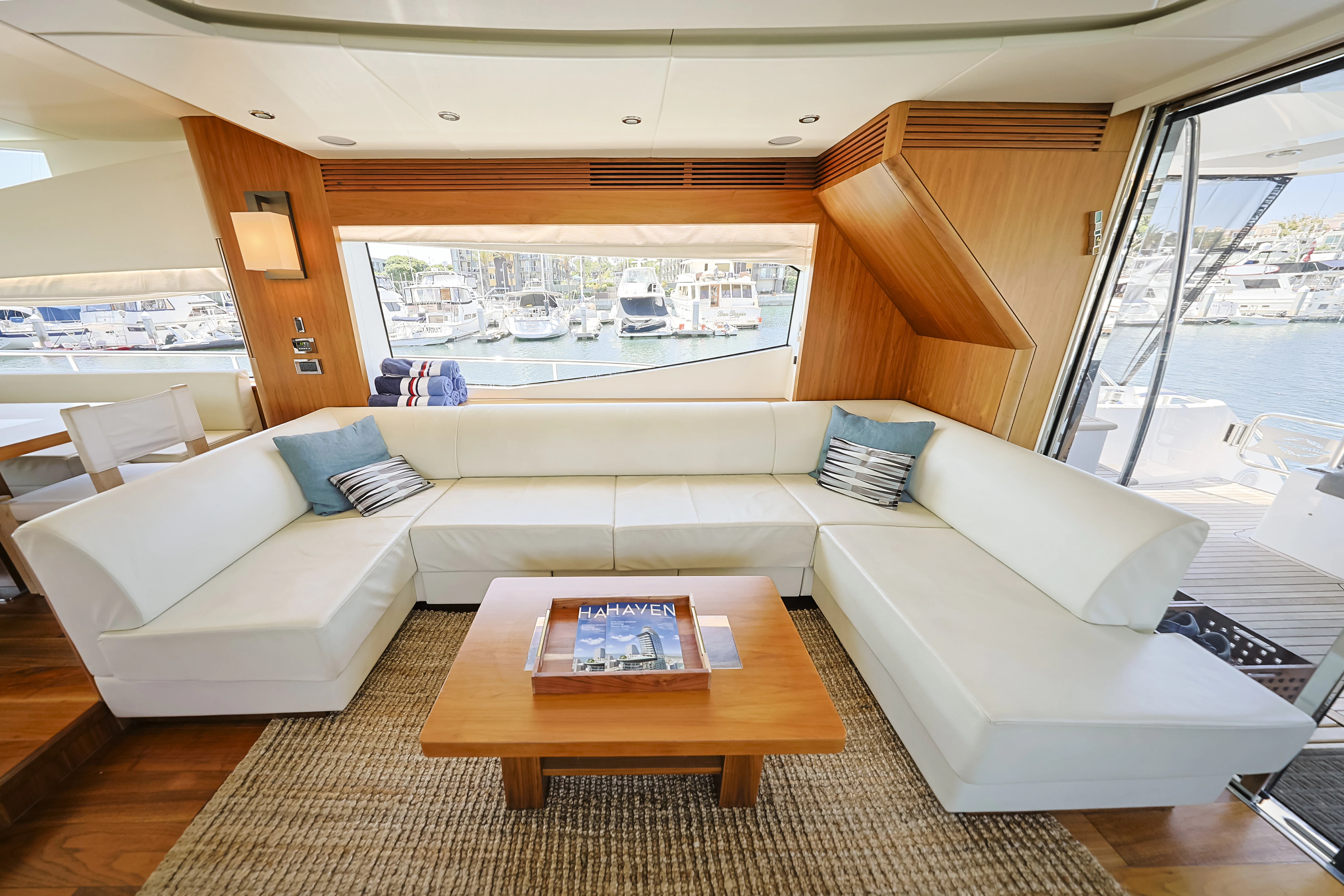 a living room with a large window aboard SEA LA VIE Yacht for Sale