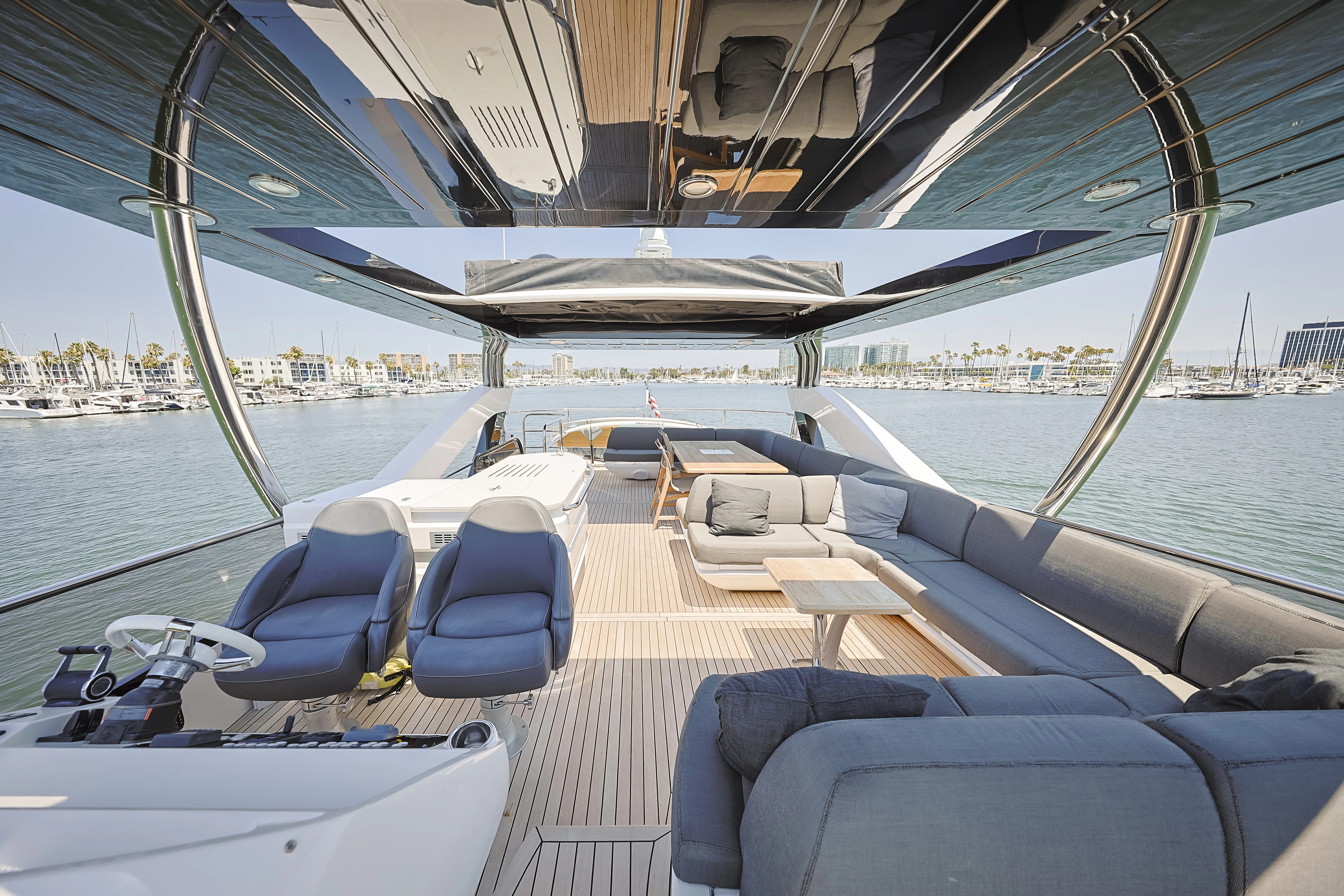 a boat with seats and a table on it aboard SEA LA VIE Yacht for Sale