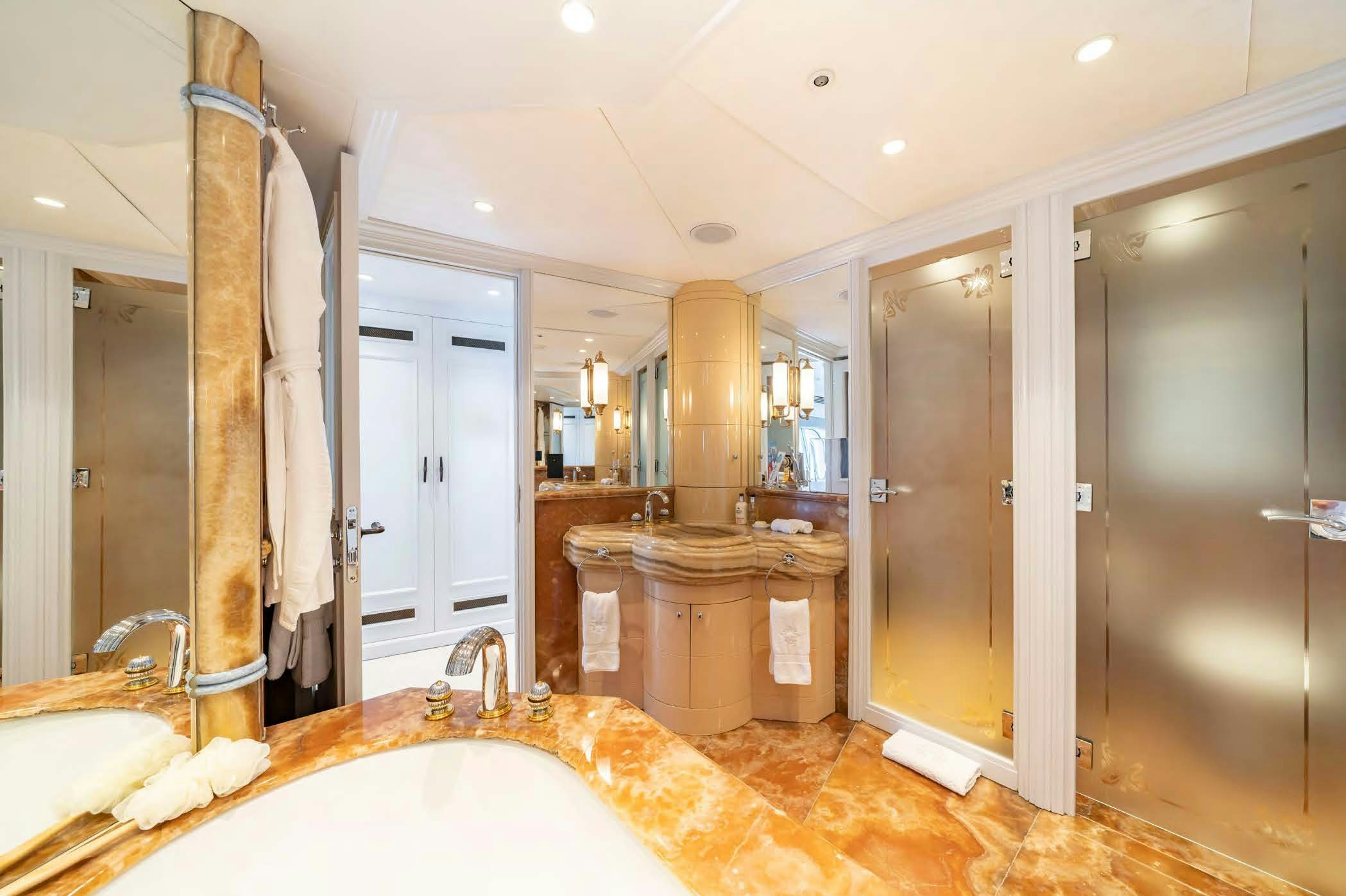 a bathroom with a large bathtub aboard MOSAIQUE Yacht for Sale