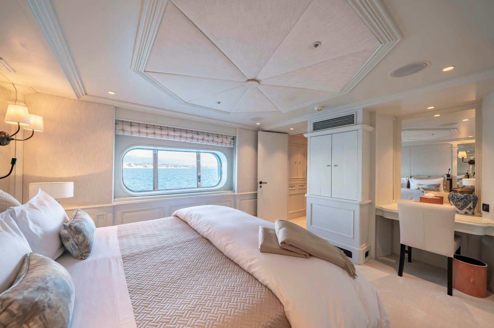a bed in a room aboard MOSAIQUE Yacht for Sale